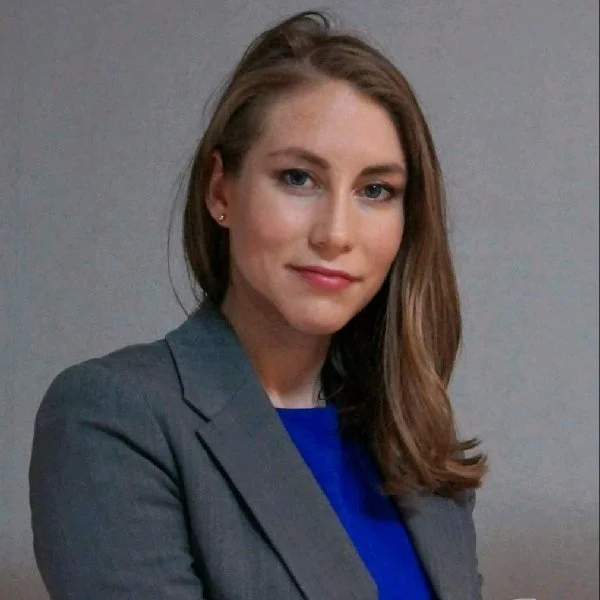 Kelly Morse in front of gray background