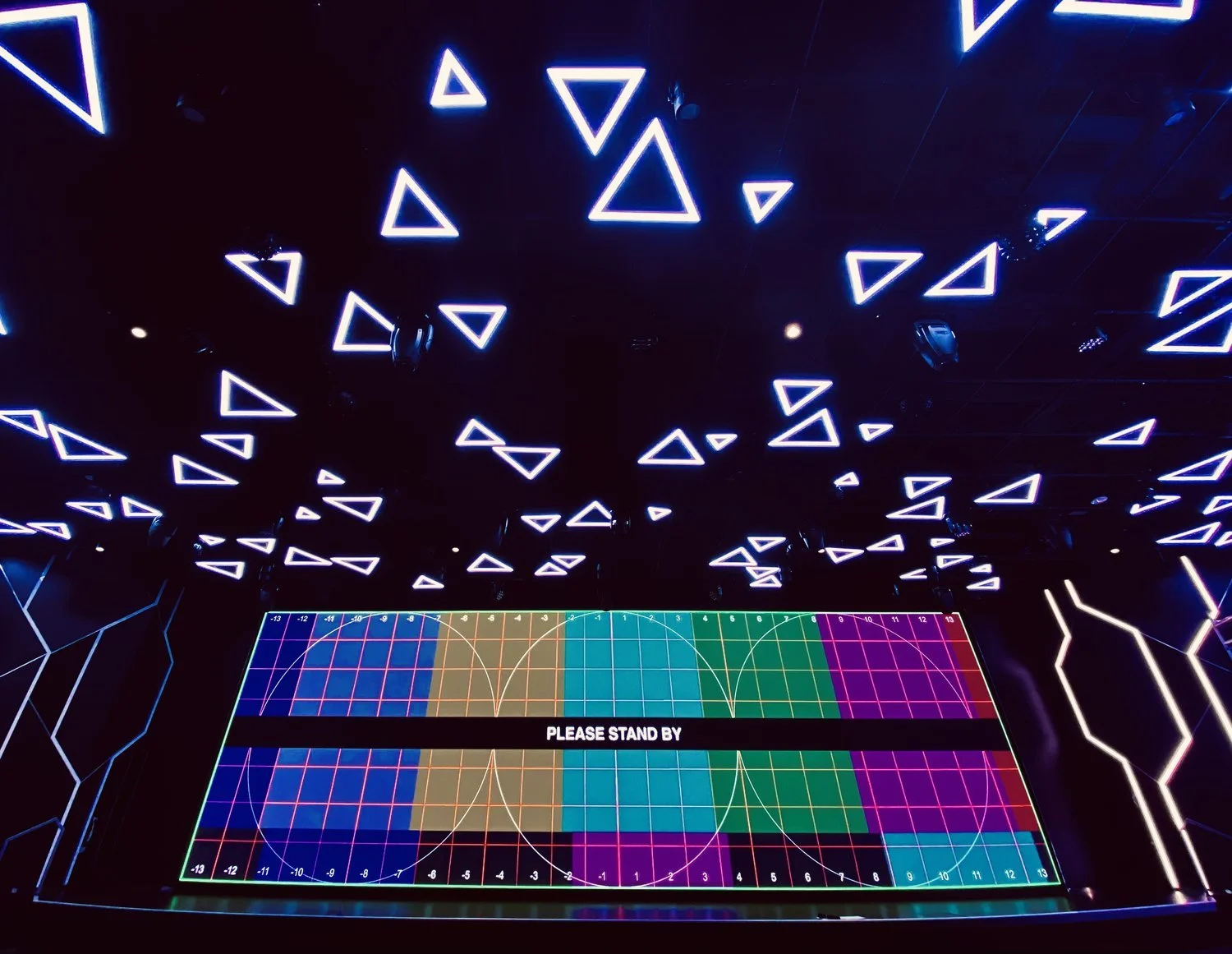 Interactive gameshow aboard an MSC cruise featuring colourful digital screen graphics and geometric visual effects.