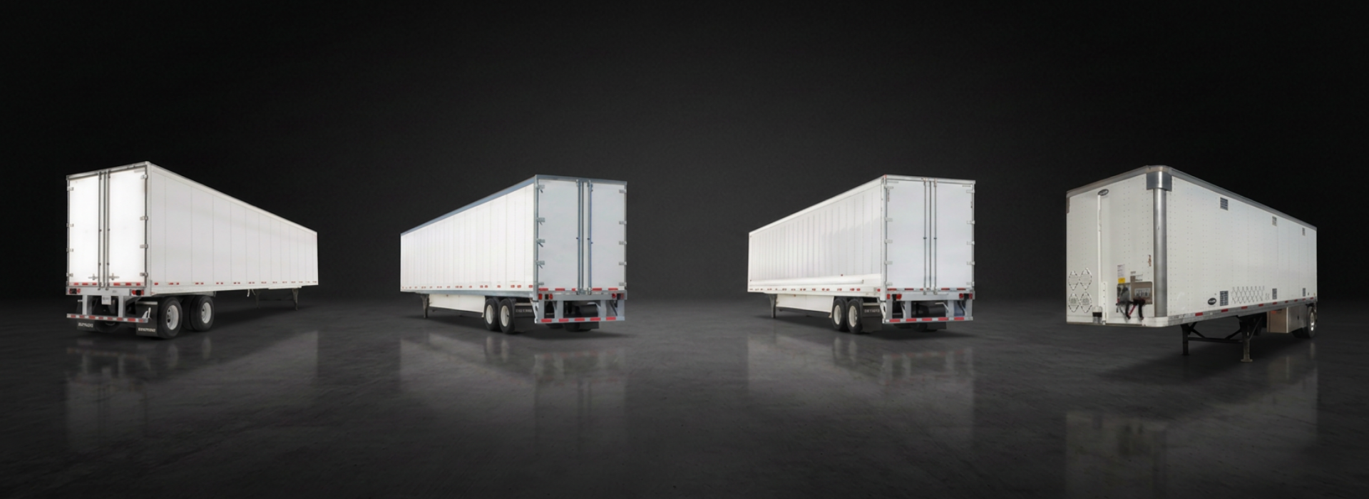 Four white semi-trailer trucks parked under a dark sky on a reflective surface.