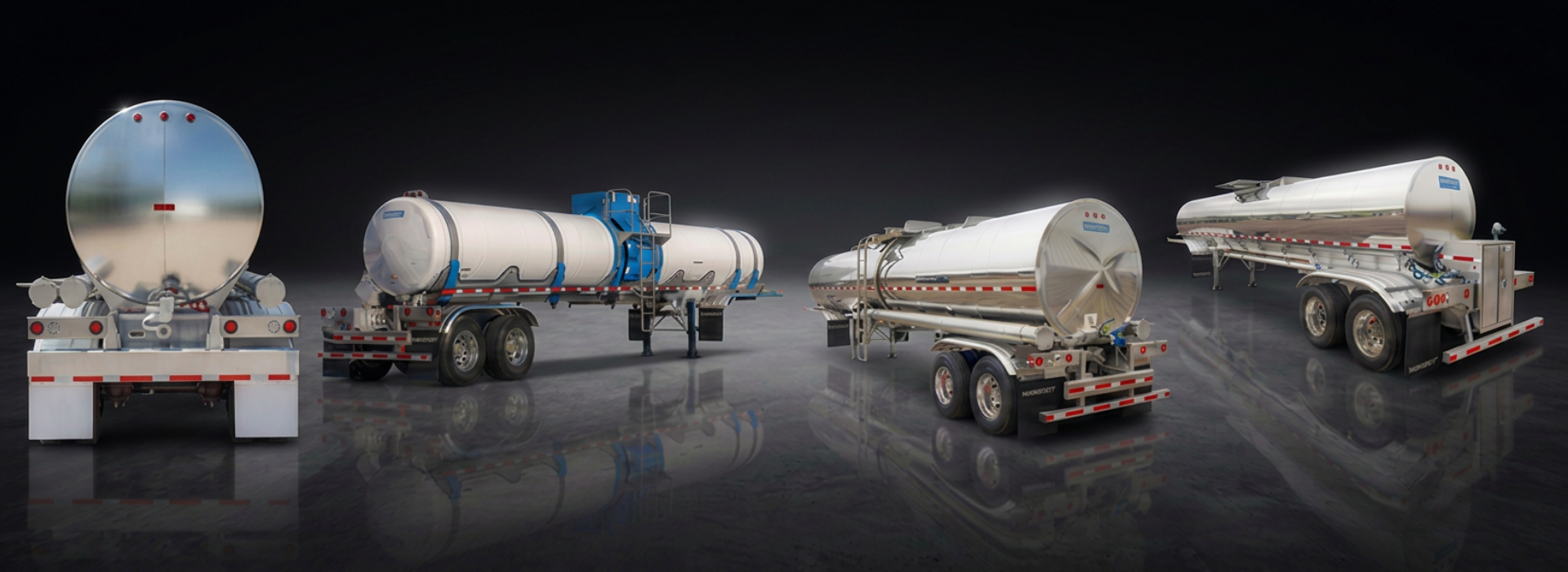 Four metallic tanker trailers lined up on a reflective surface against a black background.