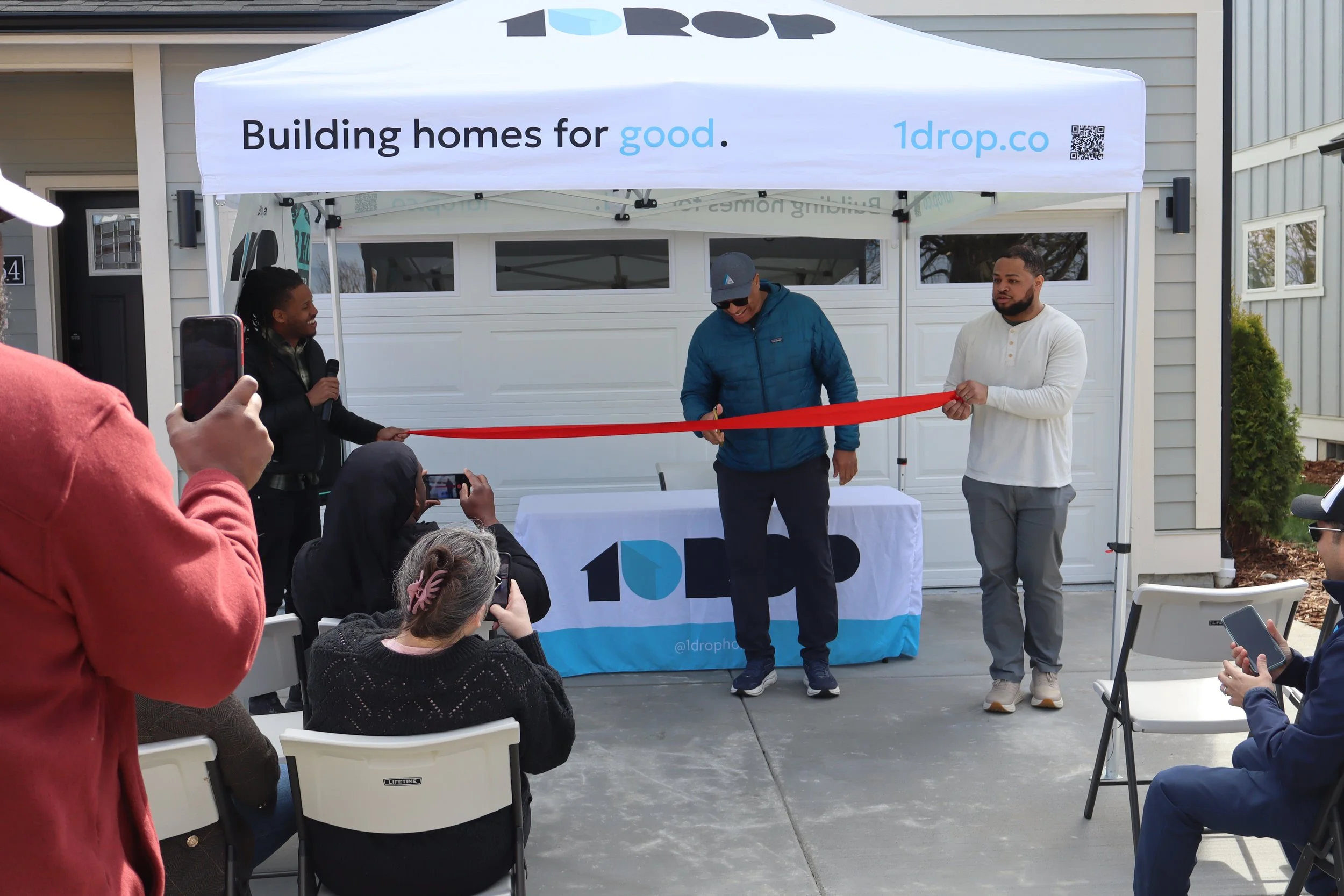 1DROP Member Michael Hopkins Celebrates Completion of 3 New Homes at 28th Street Ribbon Cutting