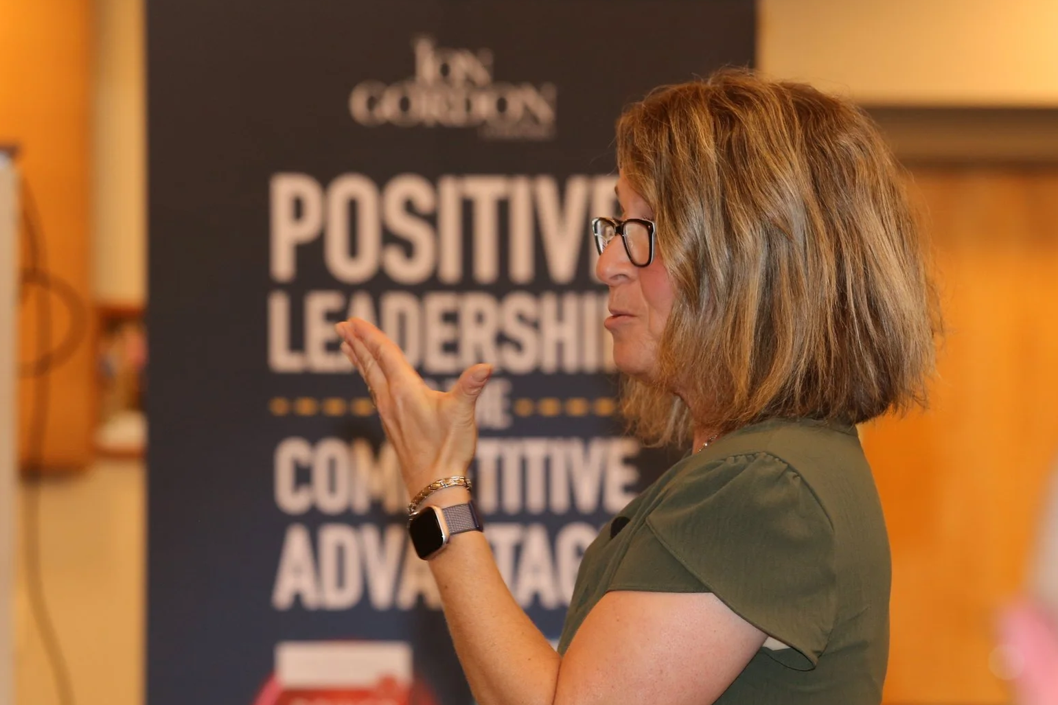 Keynote speaker using hands to make a point