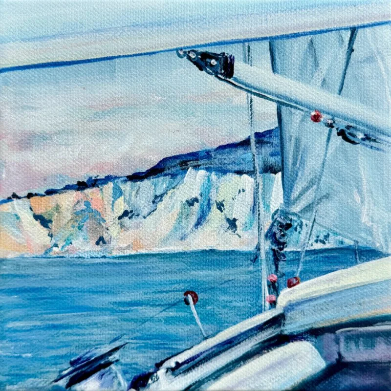 Watercolor painting of a sailboat on the water with a mountainous island in the background.