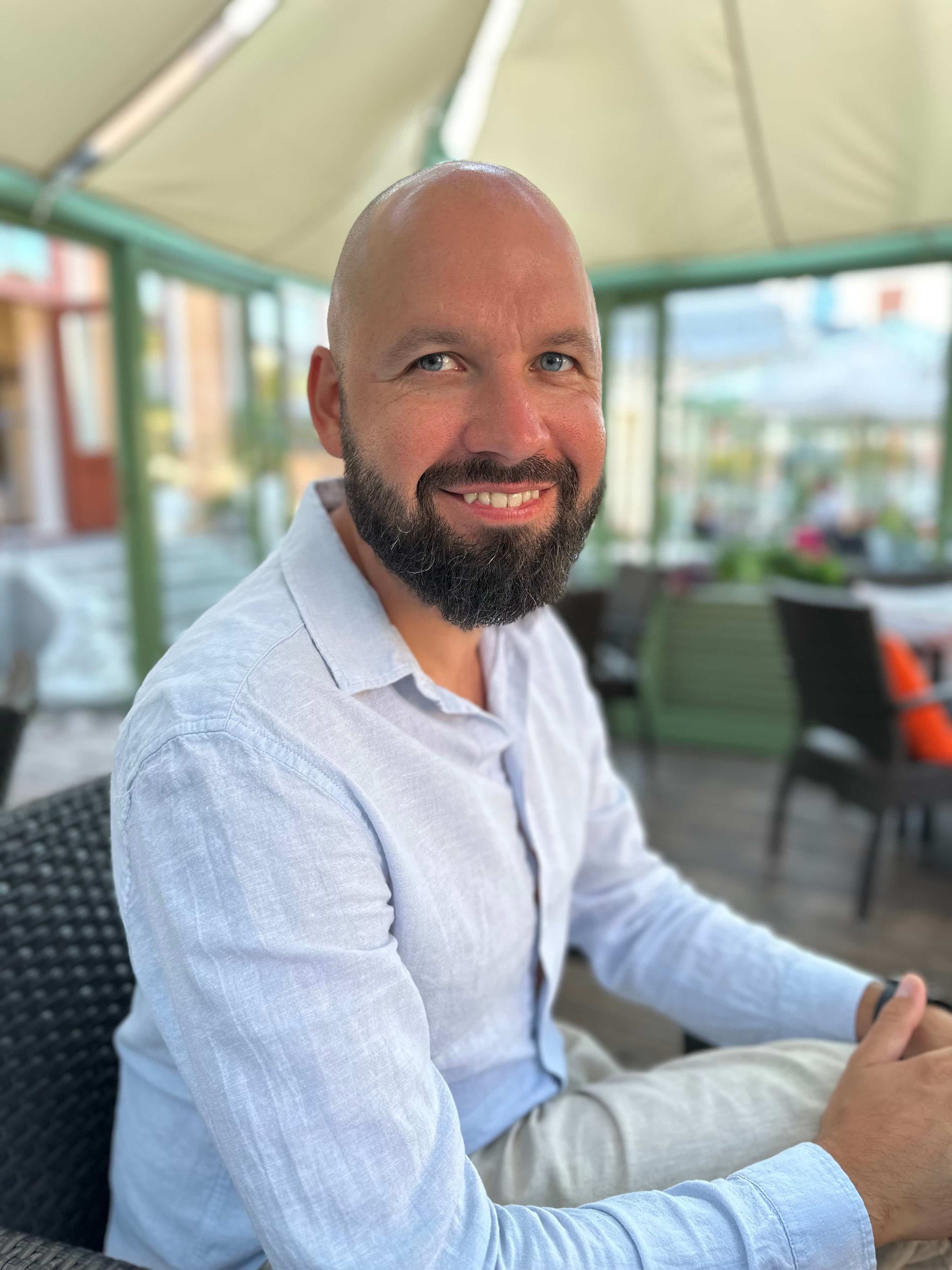 Gediminas sitting in the city, founder of UOGAweb Squarespace website design agency