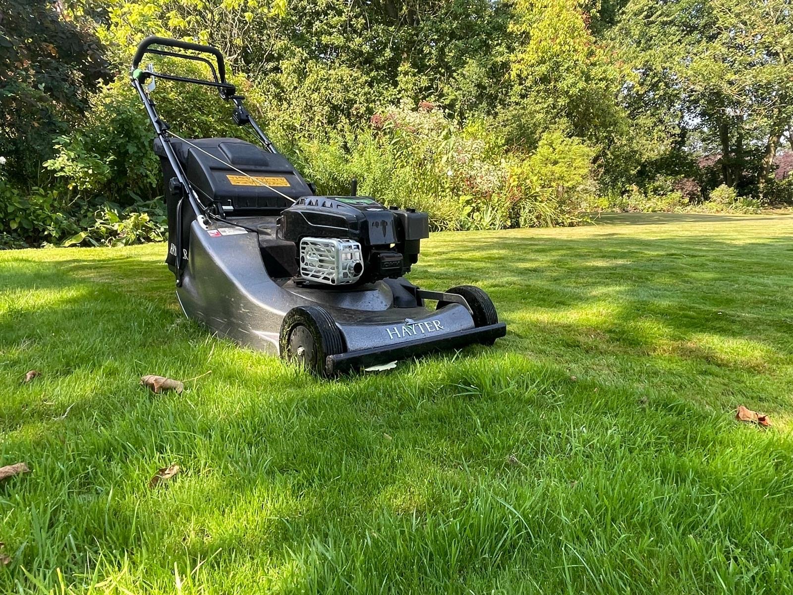 Lawn mower cutting grass