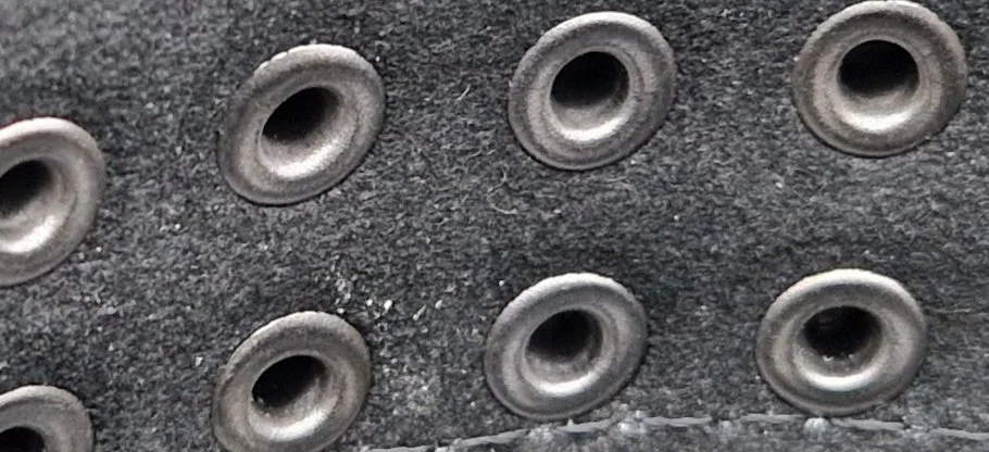 Photo of studs with rivet fixing