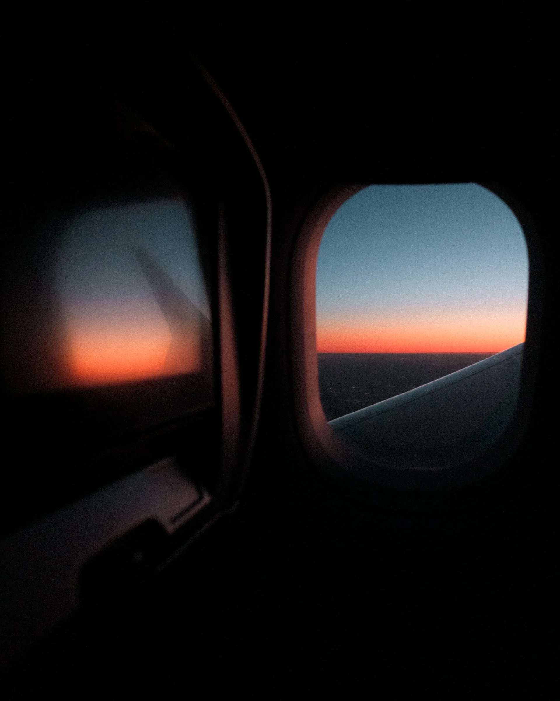 IMG_3739_SunriseThruAirplaneWindow.jpg