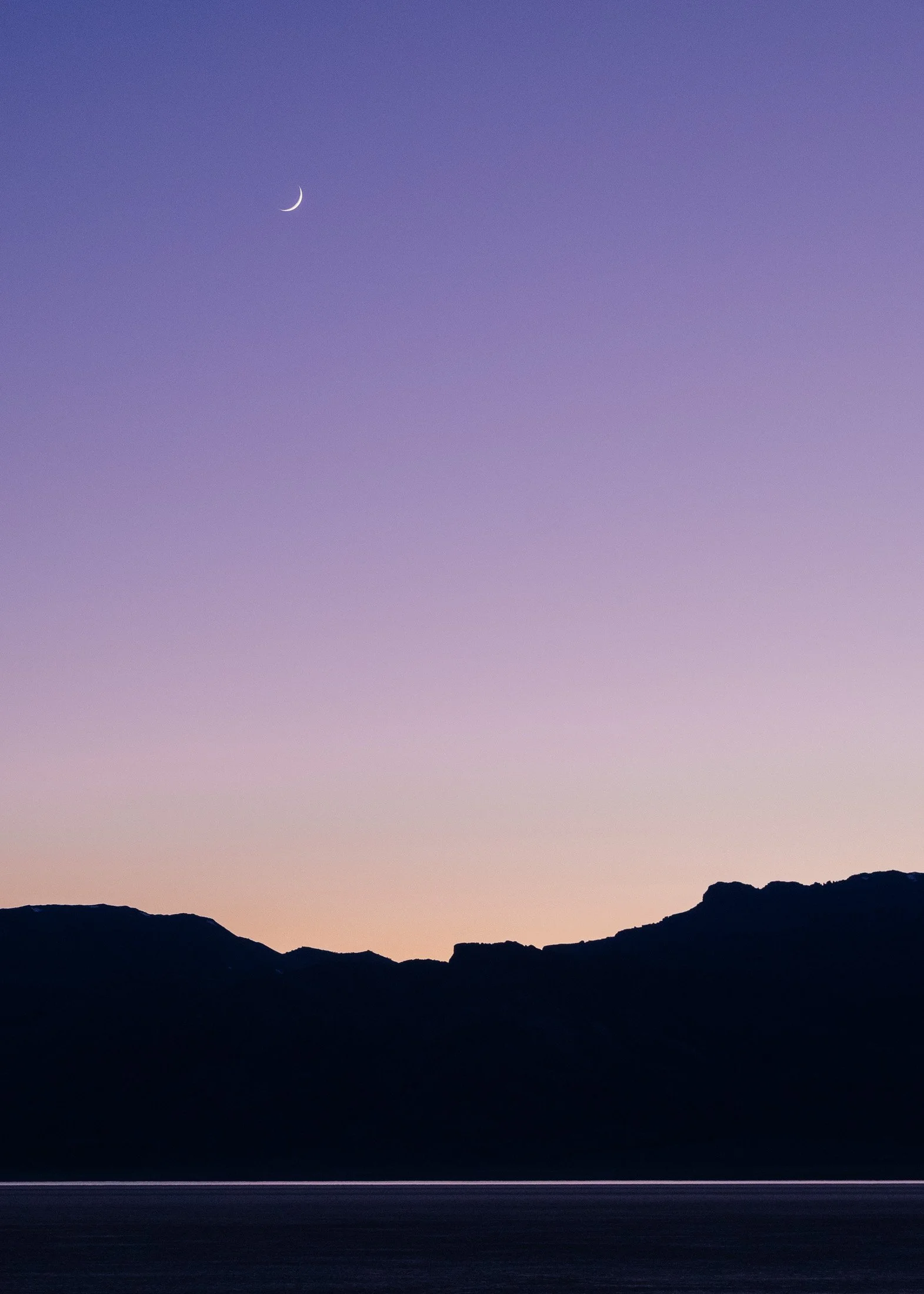 Moonrise Over Desert Sunset. Alvord Desert.