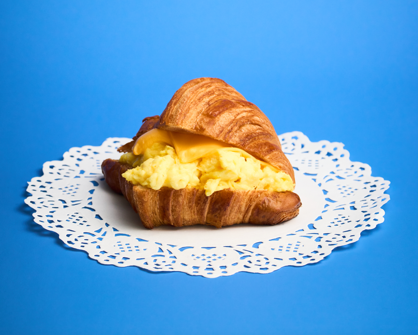 Fluffy eggs and melted cheese on a buttery, flaky croissant made in-house. Warm, satisfying, and perfectly simple, this breakfast classic delivers rich flavor and soft, golden layers in every bite.