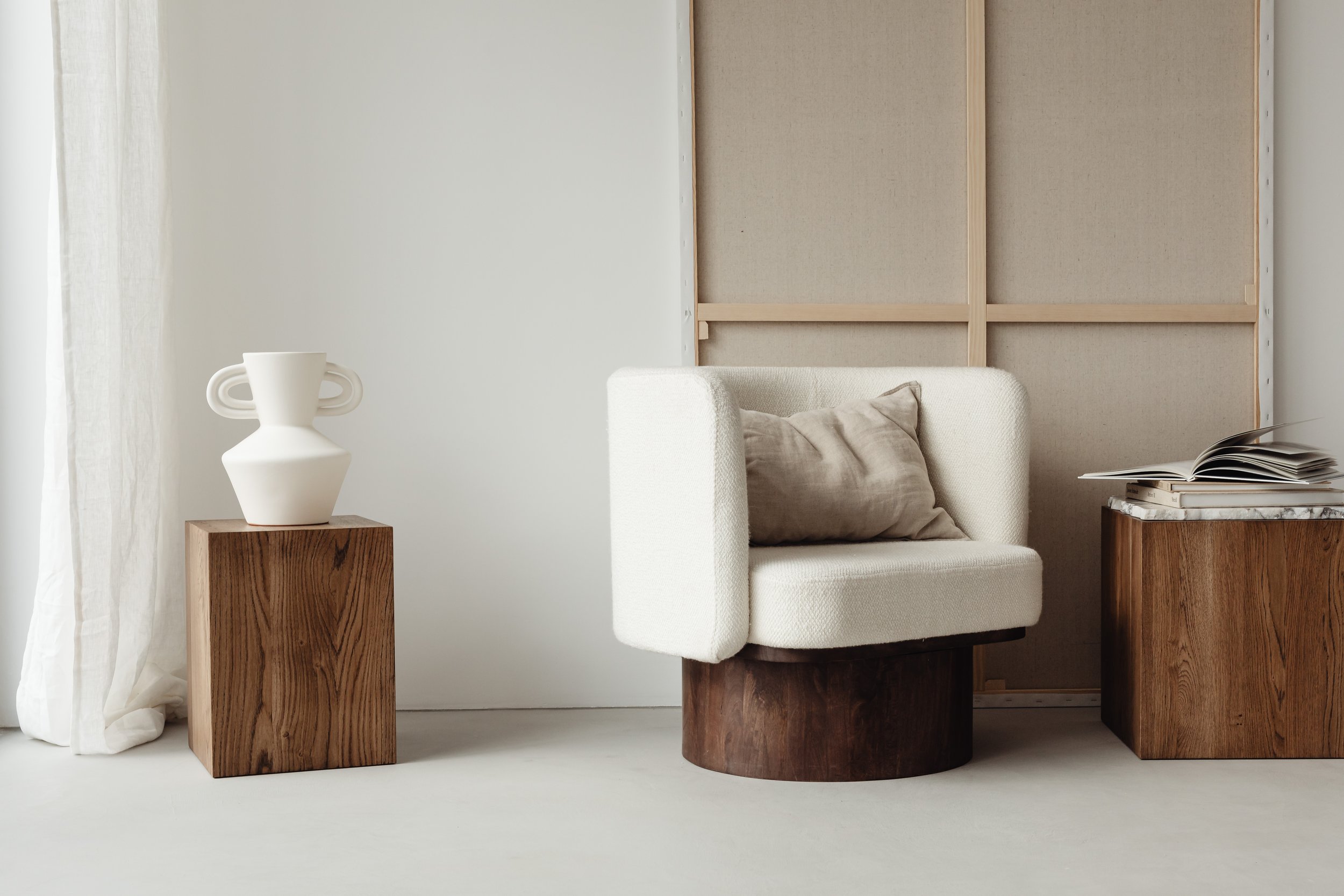 kaboompics_open-book-auxiliary-table-cube-walnut-wood-pedestal-sculpture-upholstered-armchair-26662.jpg