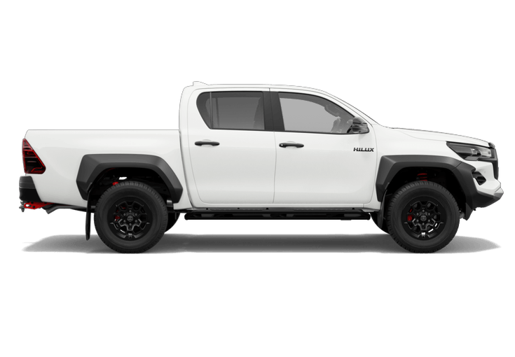 White Toyota Hilux pickup truck with black wheels and detailing, set against a black background.