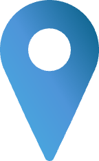 A person in a white shirt and glasses holding a microphone and speaking.