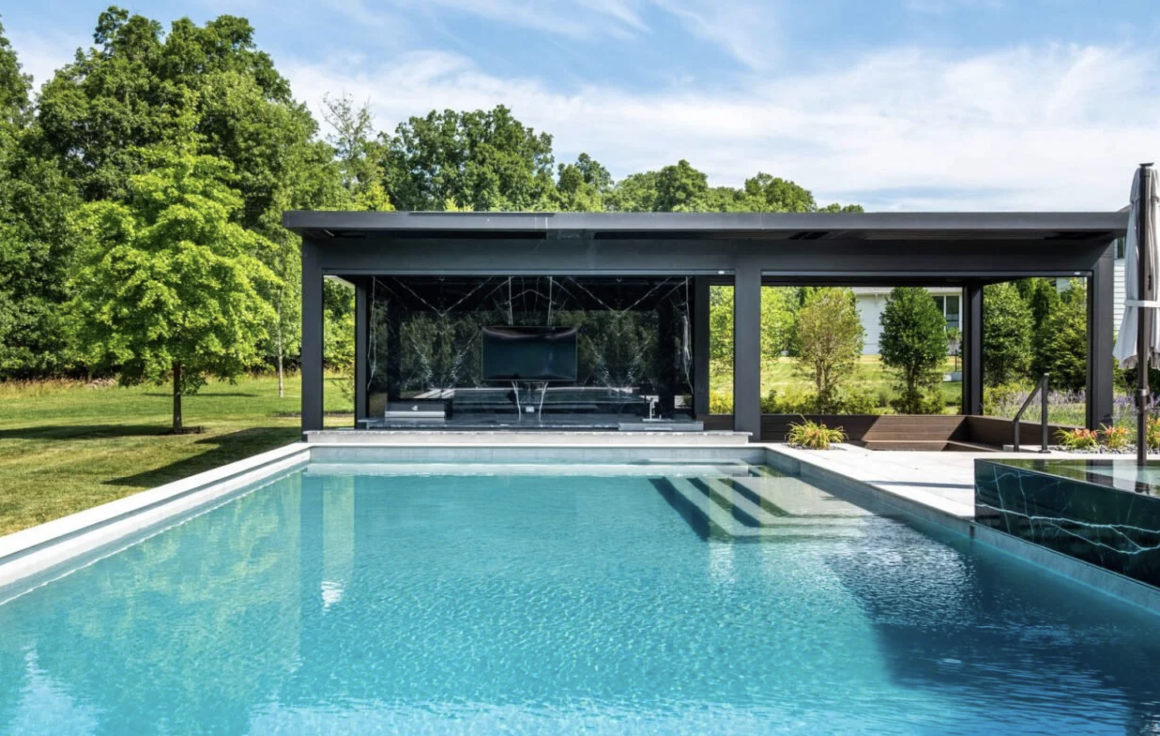 outdoor struxure louvered pergola with water fall water feature