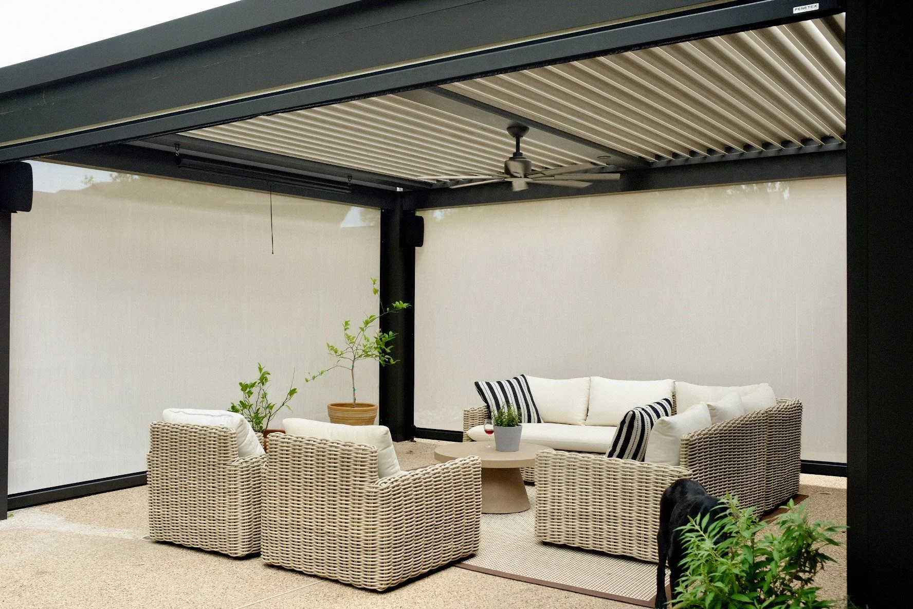 Patio furniture set under a Goodlux Outdoor StruXure pergola