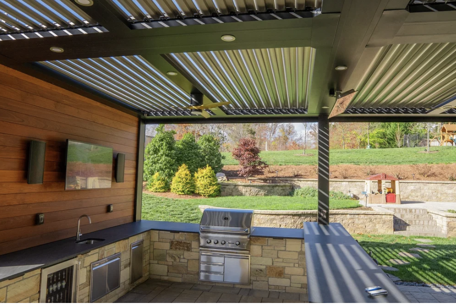 year round outdoor struxure pergola with tv, speakers, outdoor kitchen, heaters and grill