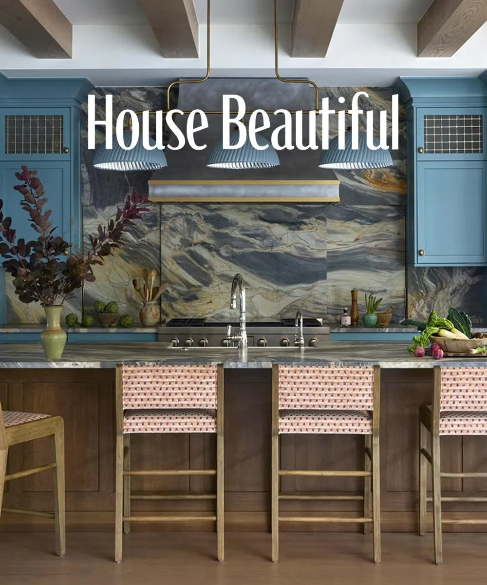 House Beautiful June 2026 feature on a colorful Ann Arbor, Michigan home designed by Ramsay Nye Interior Design, showing the kitchen with blue cabinetry and a dramatic quartzite backsplash.