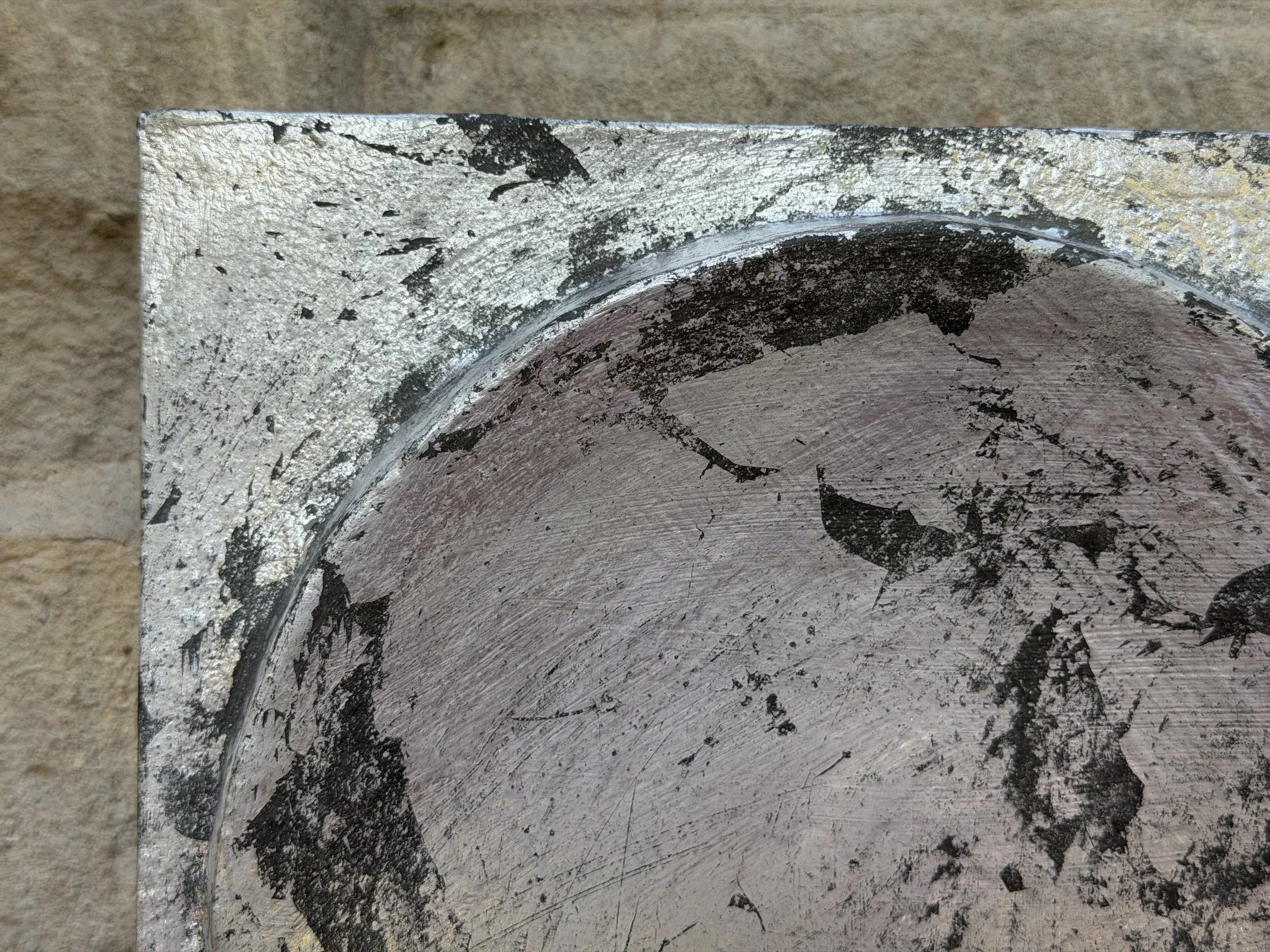Close detail of Silver and Bronze on Concave Moon showing the silver leaf broken by dark bronze
