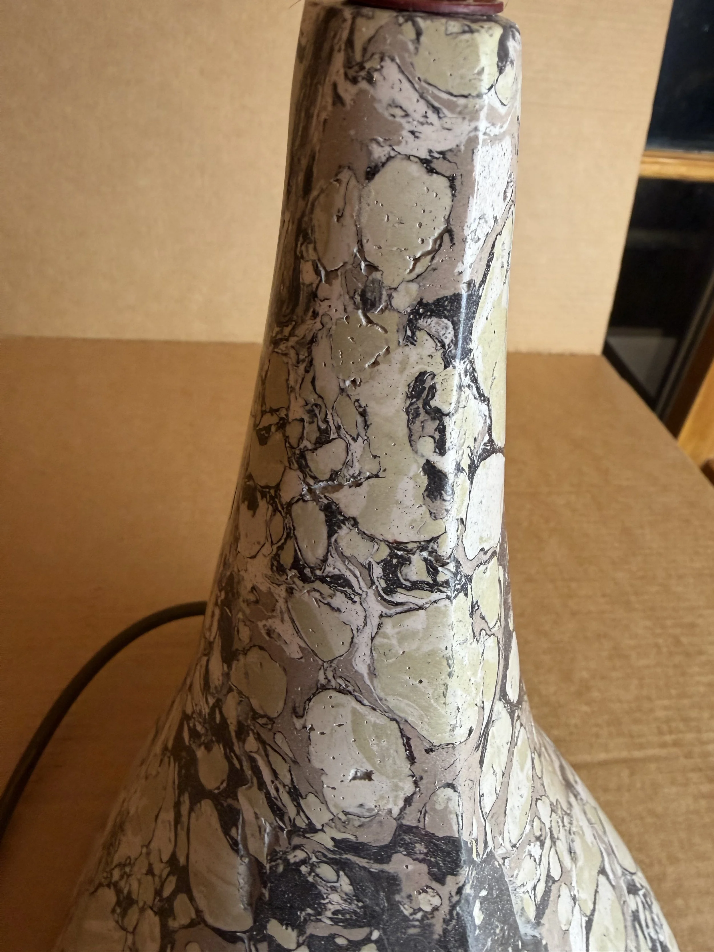 Green and Cream Lamp base seen from one side, showing the sweep of the flared cone