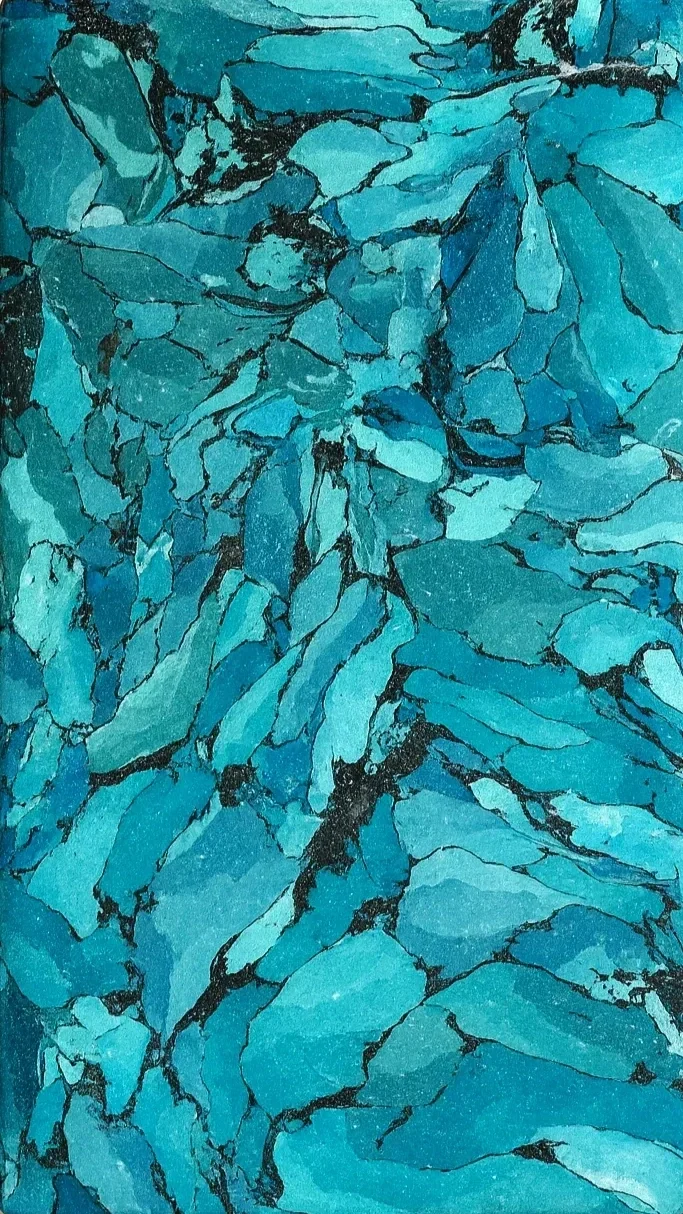 Close-up of a surface with turquoise marble-like pattern and dark veining.