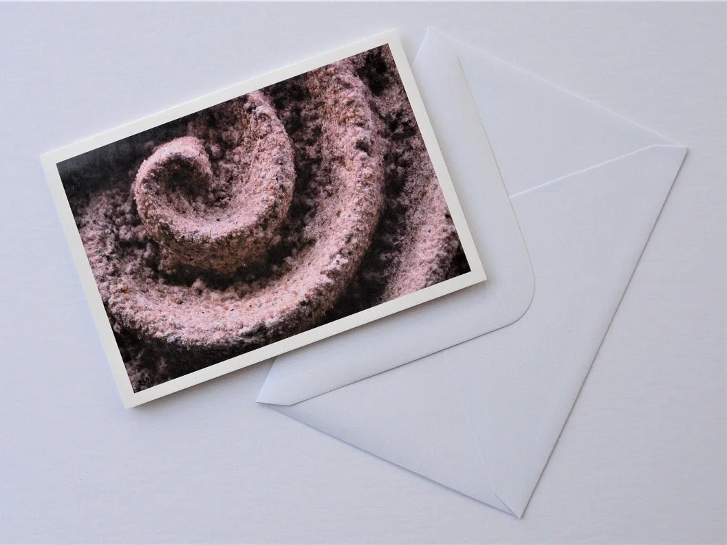 Raked Water Sculpture greetings card shown at an angle with its white envelope