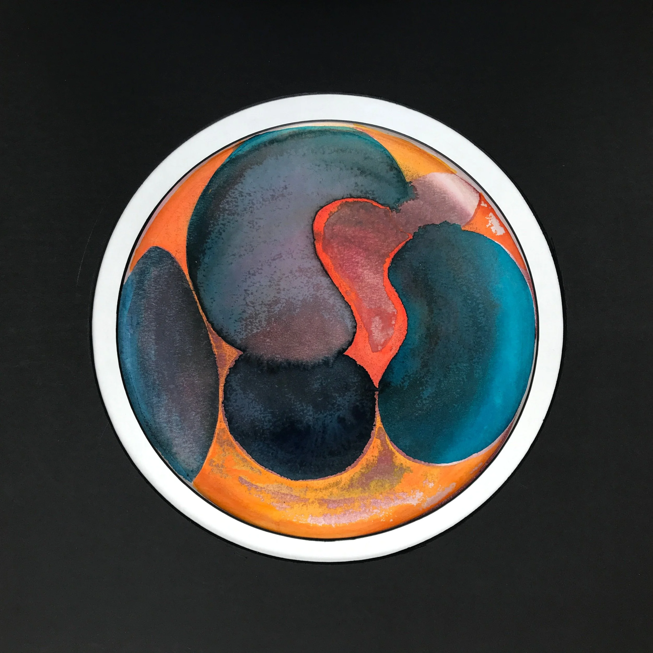 Luminous Painted World, a circular painting of deep blue and coral forms framed in white on black