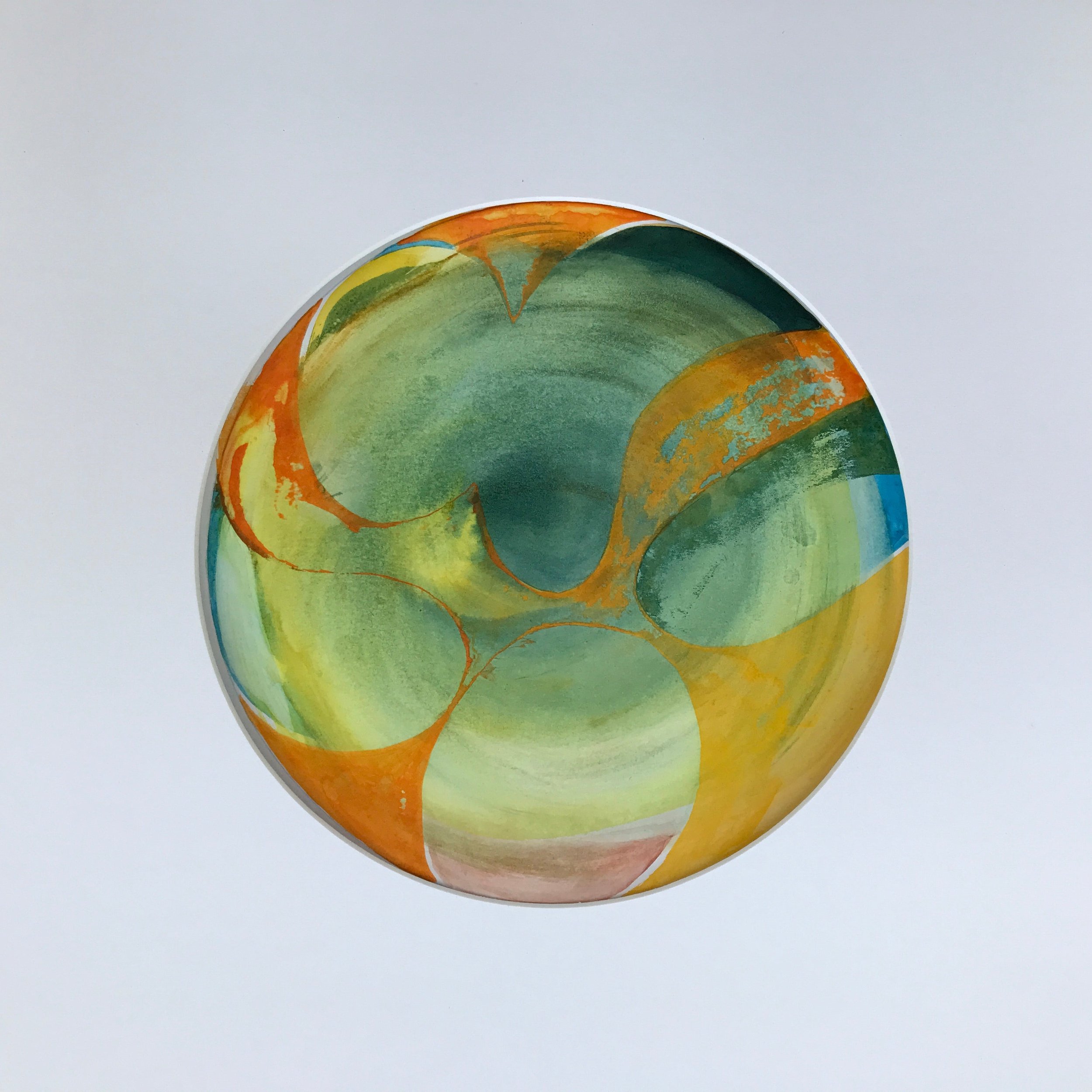 Orange Fruit Painted World, a circular painting of amber and green fruit shapes on a pale ground