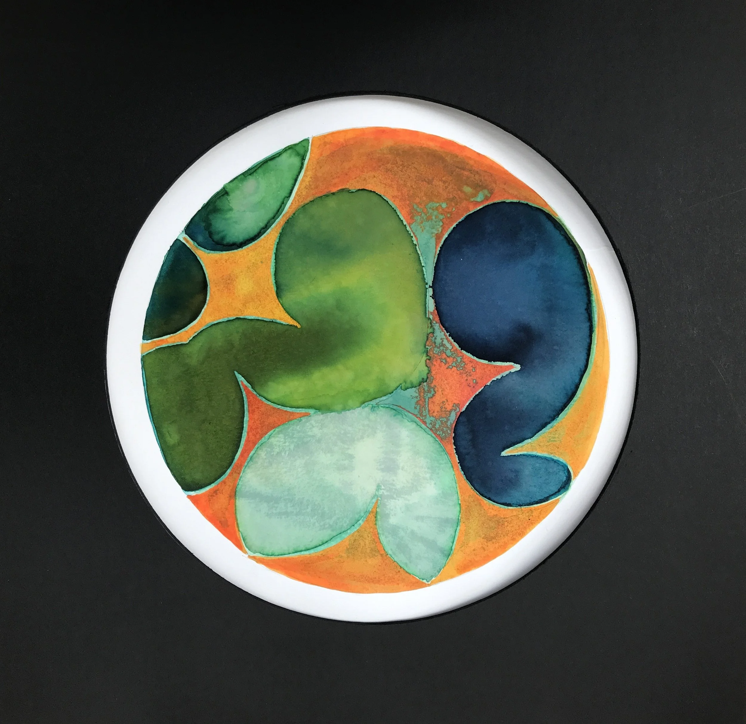 Turquoise Leafed Painted World, a circular painting of green and teal leaf shapes on an amber ground, framed in white