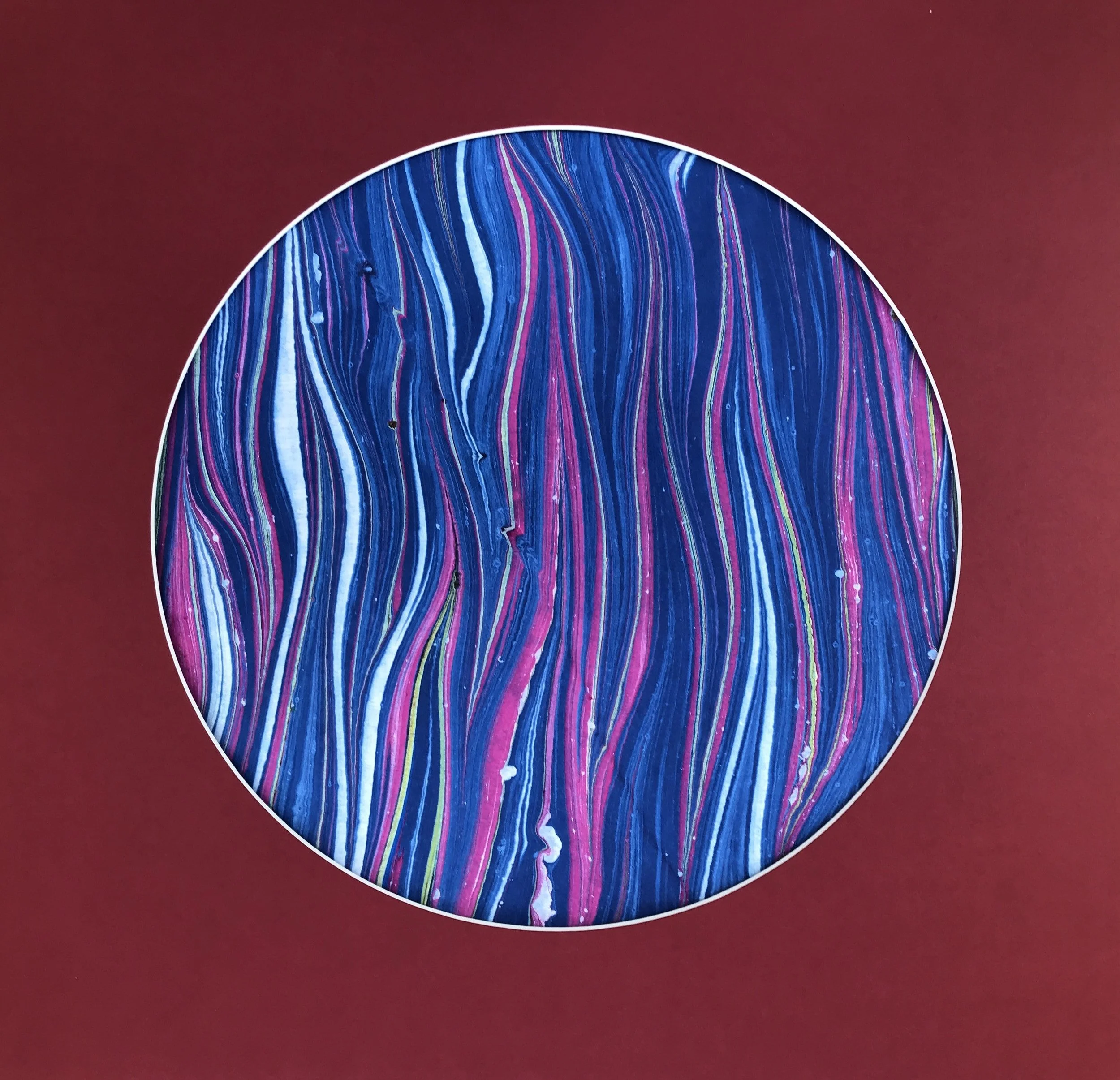 Purple Stripe Marbled Moon print, a circular disc of finely striped violet and pink marbling on deep red