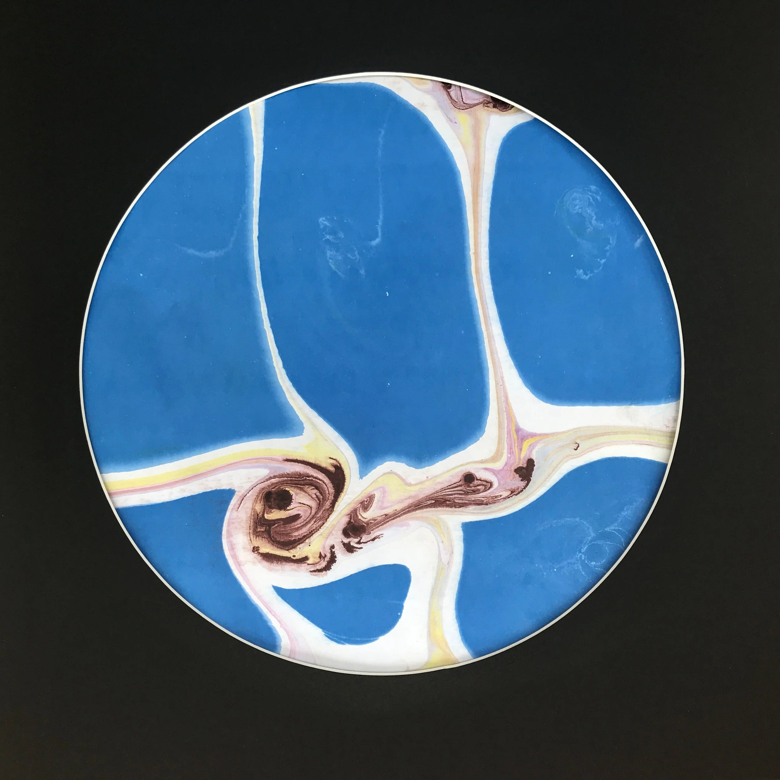 Rice Paddy Marbled Moon print, a circular disc of blue fields divided by pale marbled channels, on black