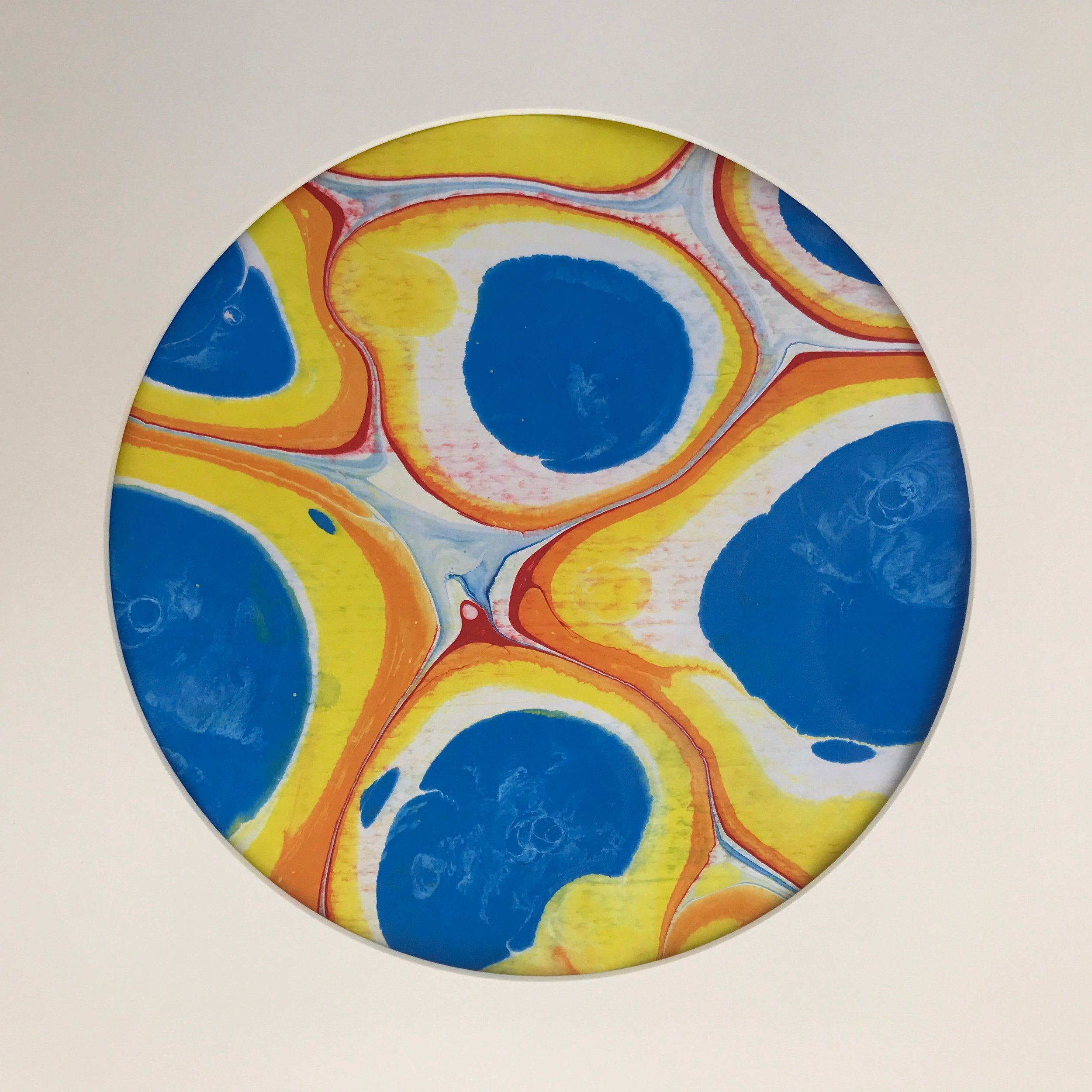 Globule Marbled Moon print, the blue and yellow globule marbling shown against a pale cream ground