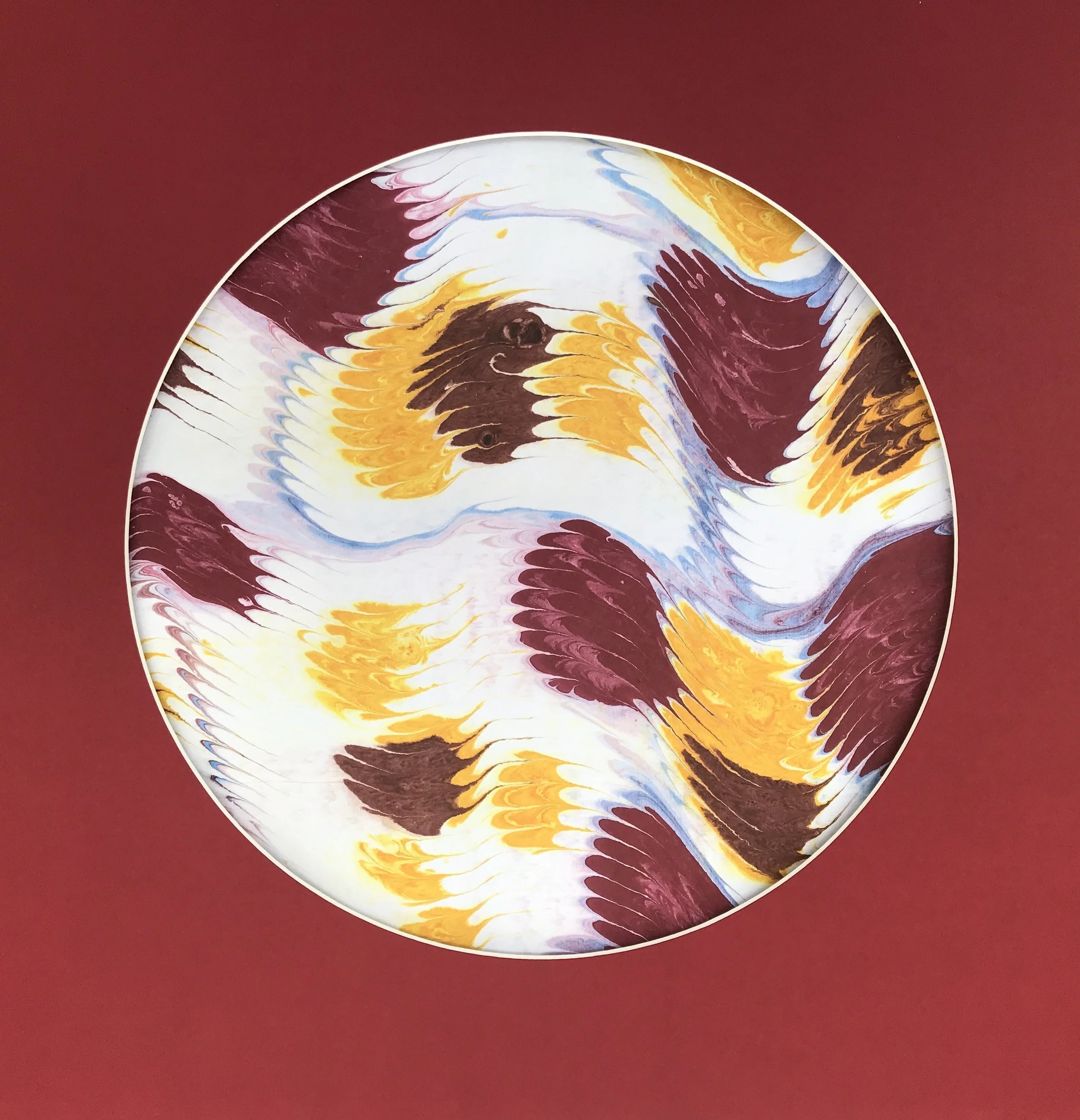 Geowave Marbled Moon print, a circular disc of ochre and burgundy marbled blocks on a deep red ground
