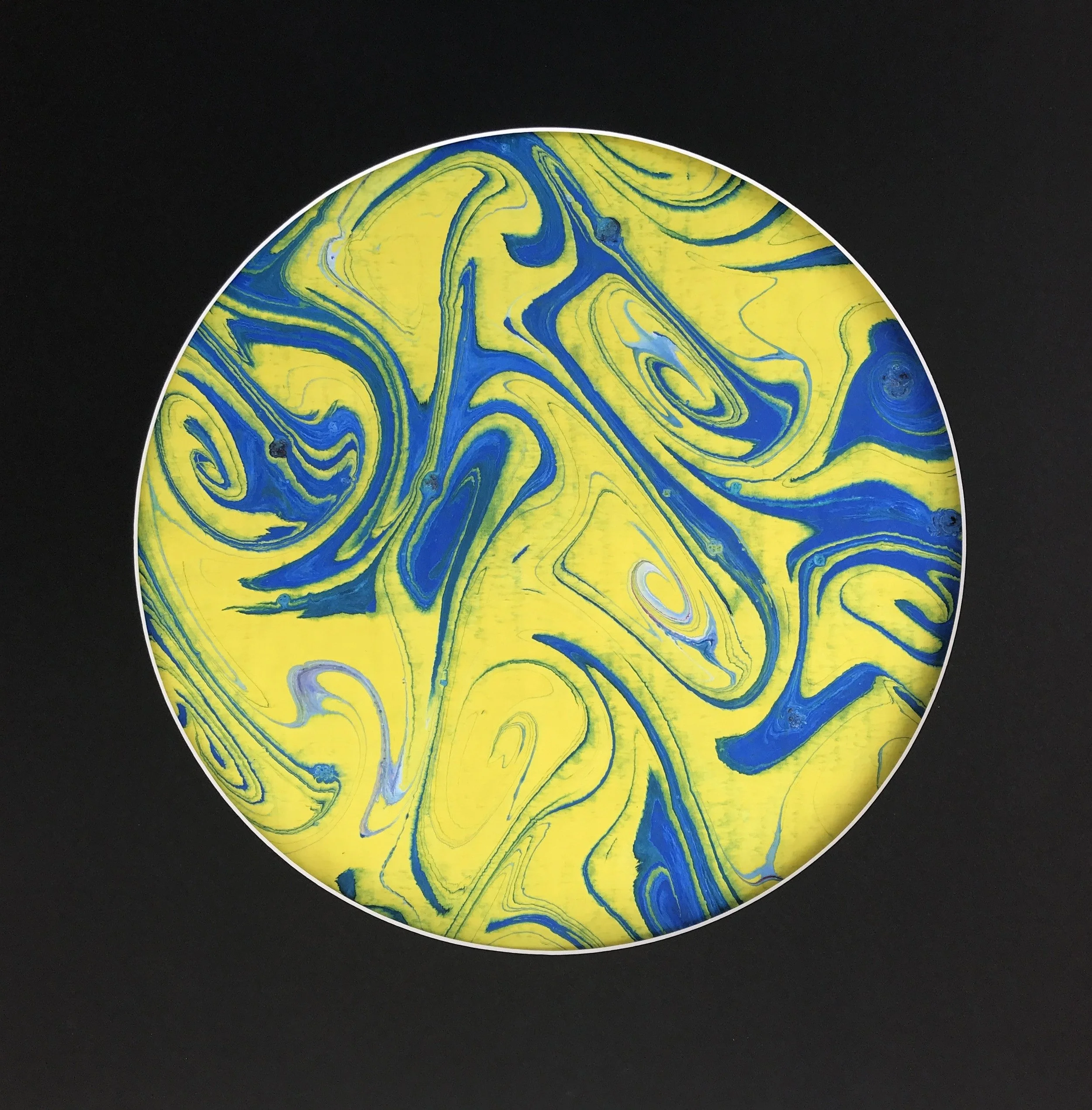 Yellow Swirl Marbled Moon print, a circular disc of yellow and blue swirled marbling on black