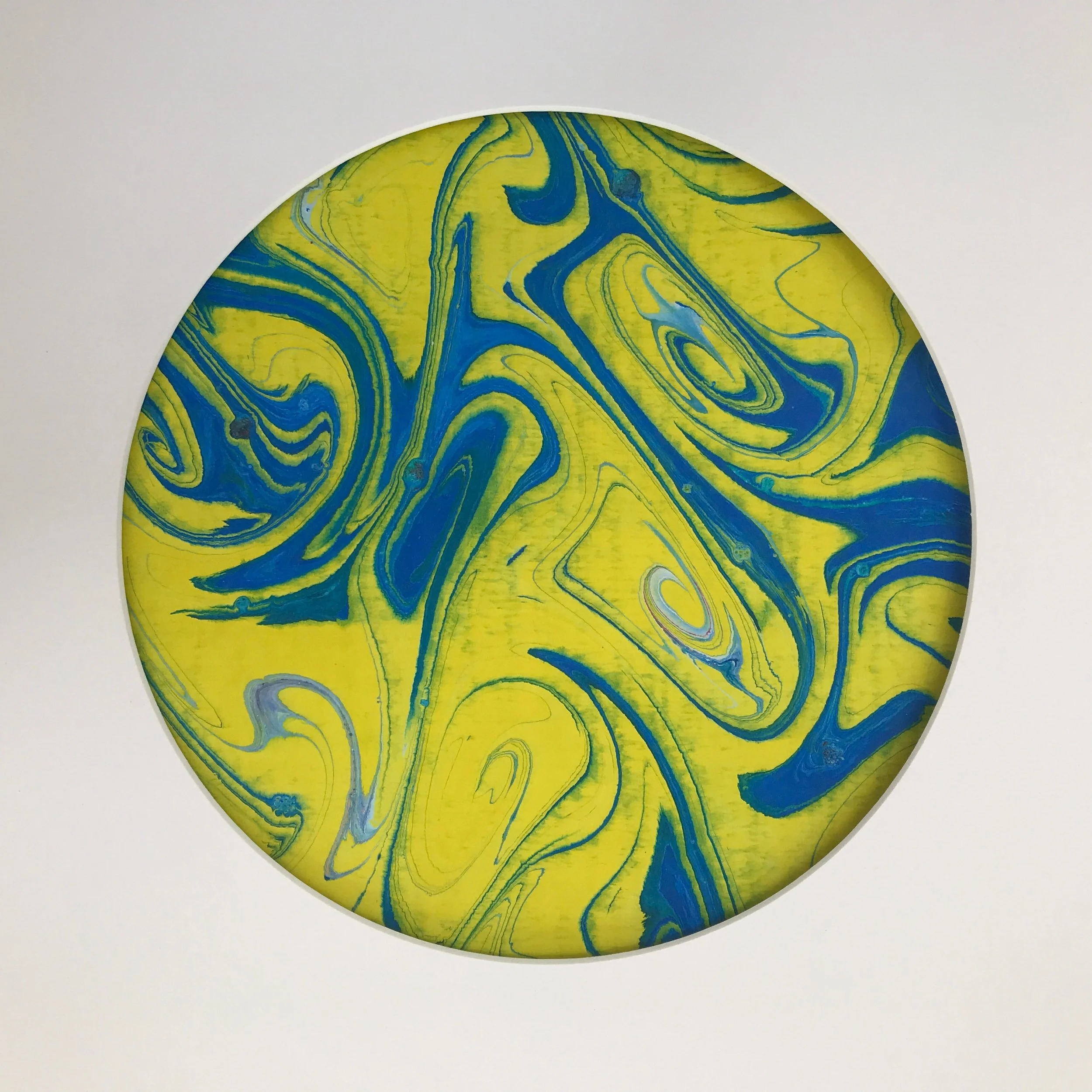 Yellow Swirl Marbled Moon print, the yellow and blue swirls shown against a pale cream ground