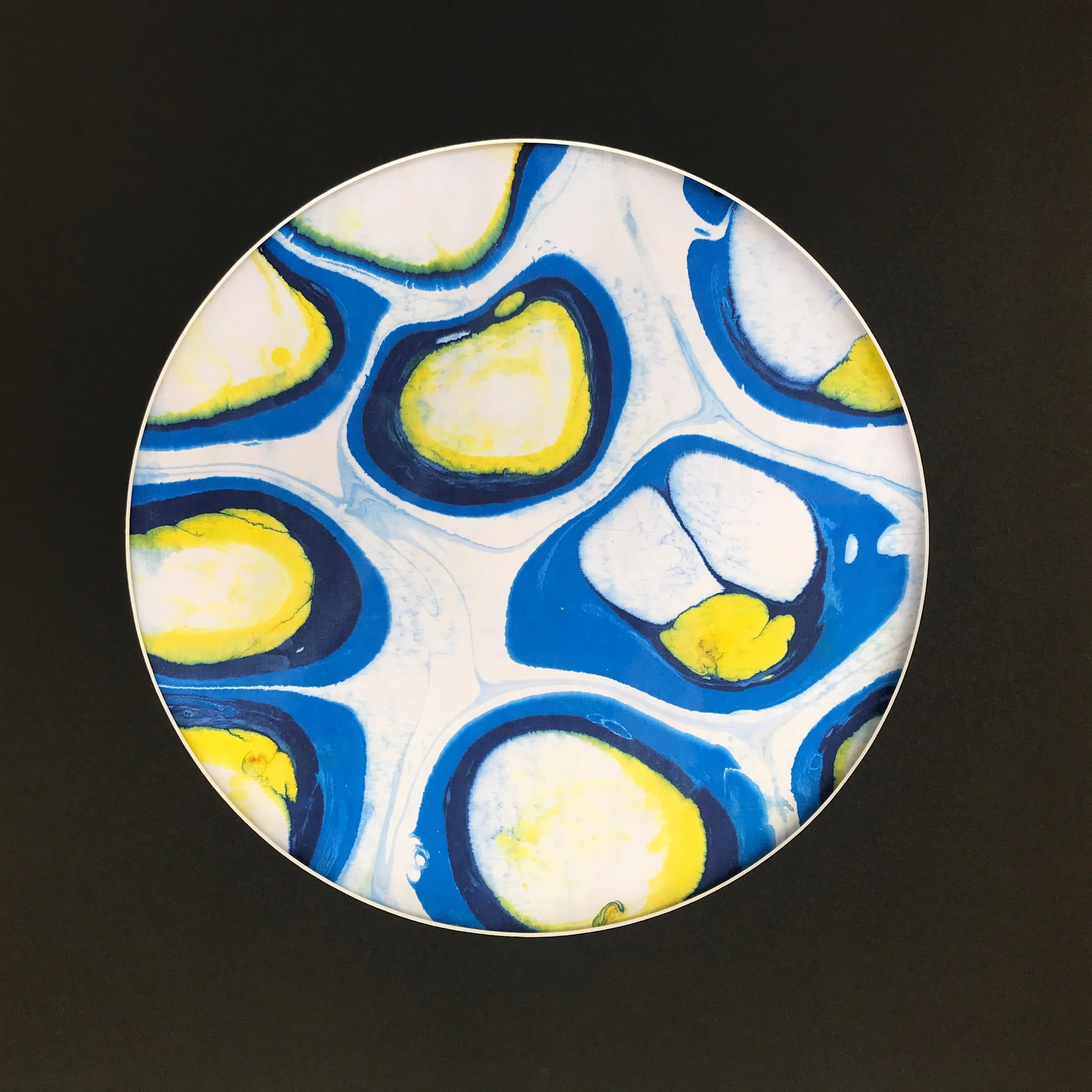 White Bubble Marbled Moon print, a circular disc of blue and yellow bubble marbling on black