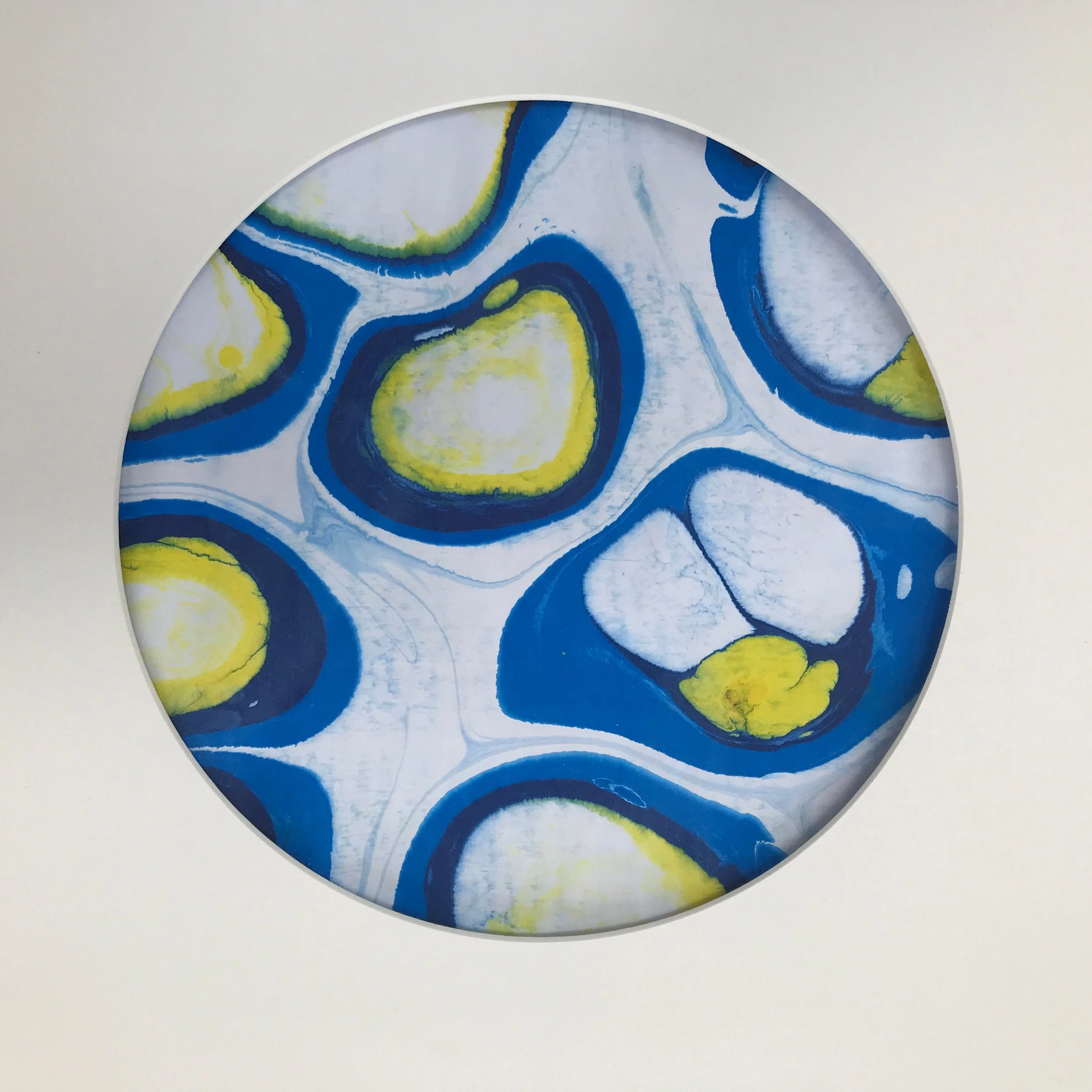 White Bubble Marbled Moon print, the blue and yellow bubble marbling shown against a pale cream ground