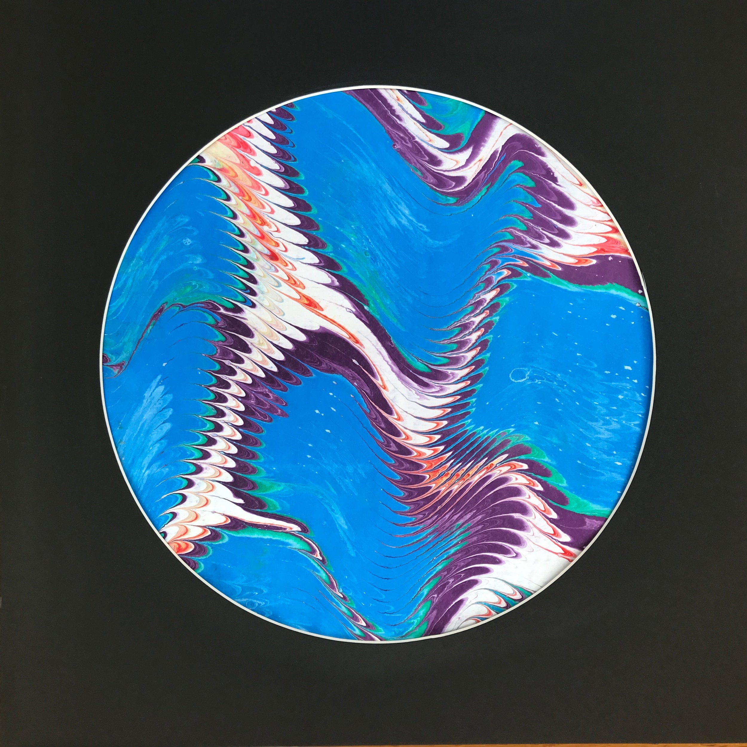 Blue Valley Marbled Moon print, the blue and violet zigzag marbling shown against black