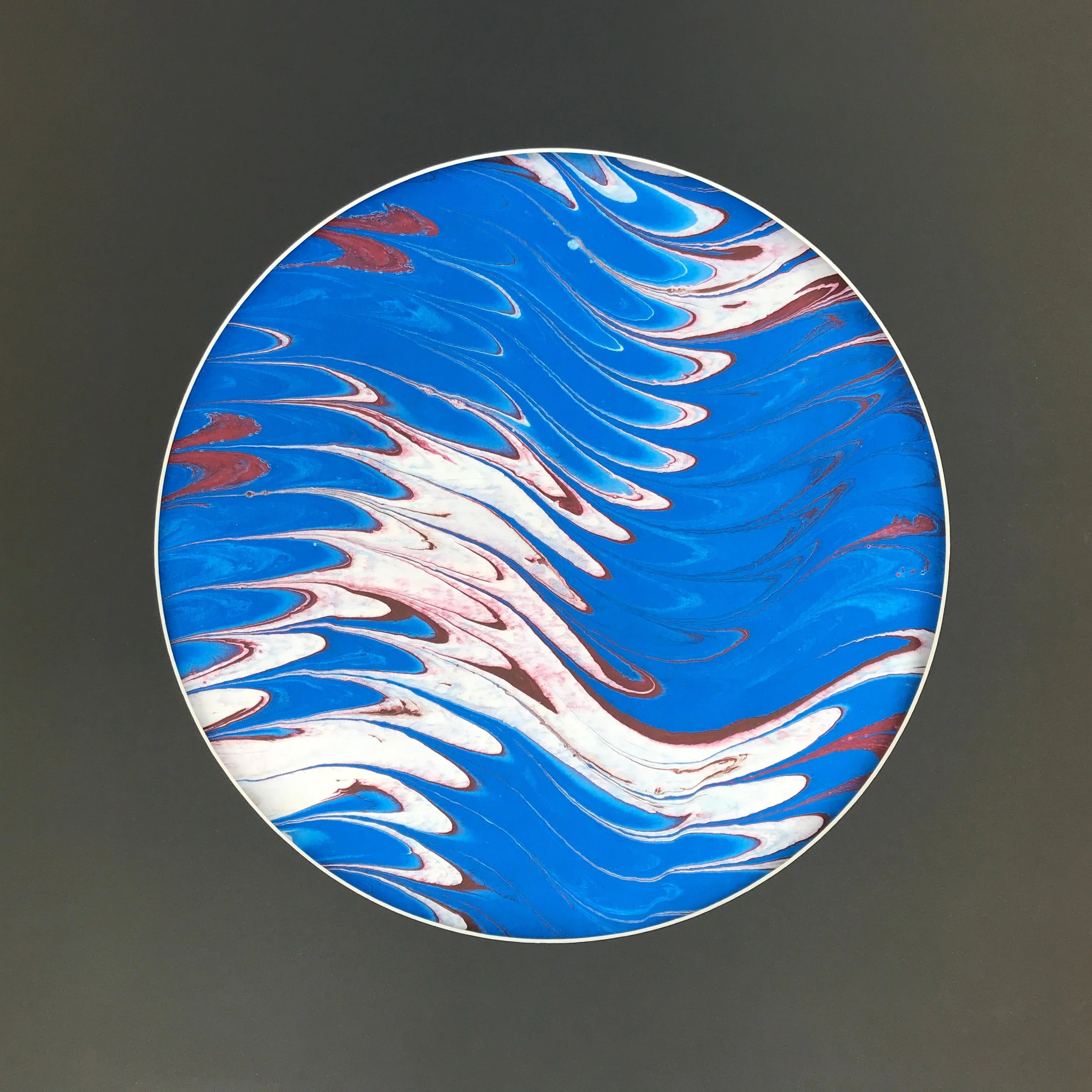 Watery Marbled Moon print, the blue and white marbled disc shown against an olive grey ground