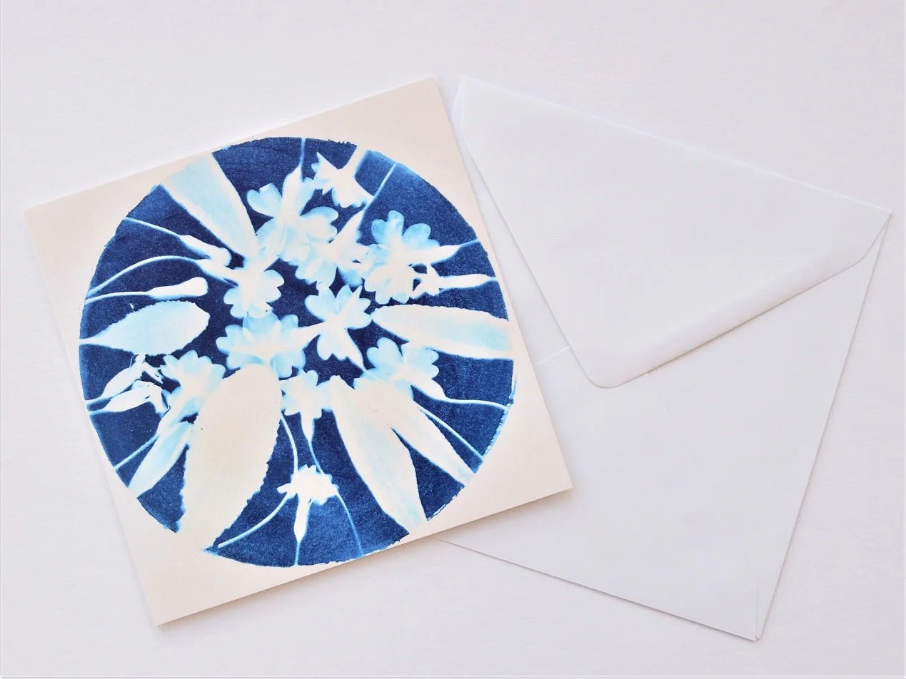 Spring is Early greetings card shown at an angle with its white envelope