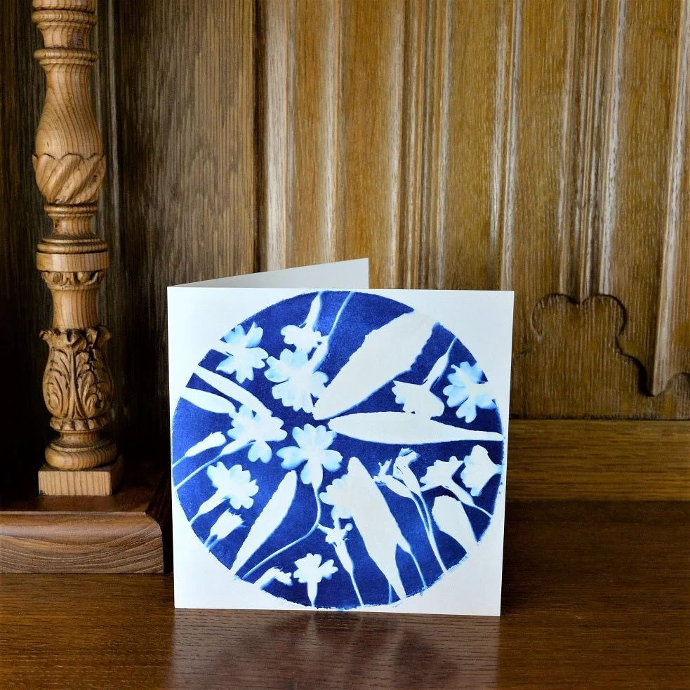 Early to Spring greetings card standing on a wooden mantelpiece
