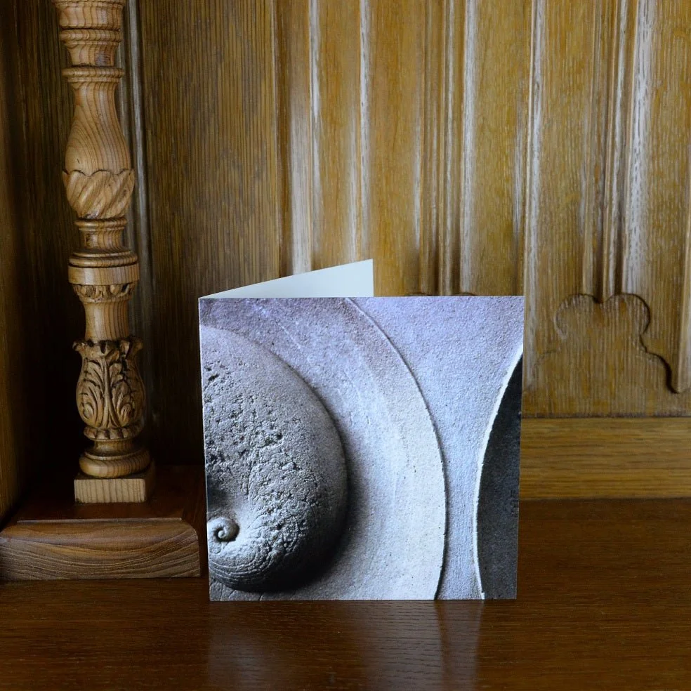 Soundwave greetings card standing on a wooden mantelpiece