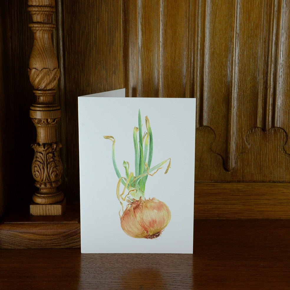 Sprouting Onion Flower Bud vertical greetings card standing on a wooden mantelpiece