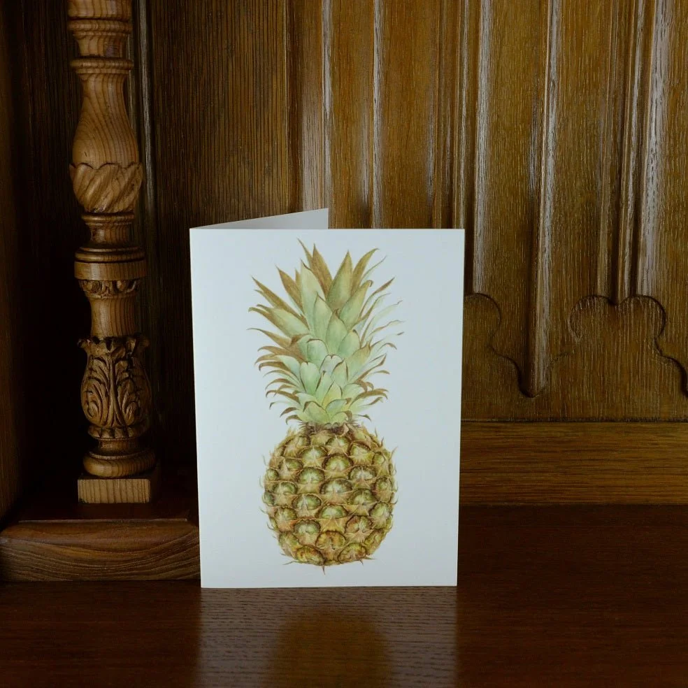 Pineapple Full Portrait greetings card standing on a wooden mantelpiece