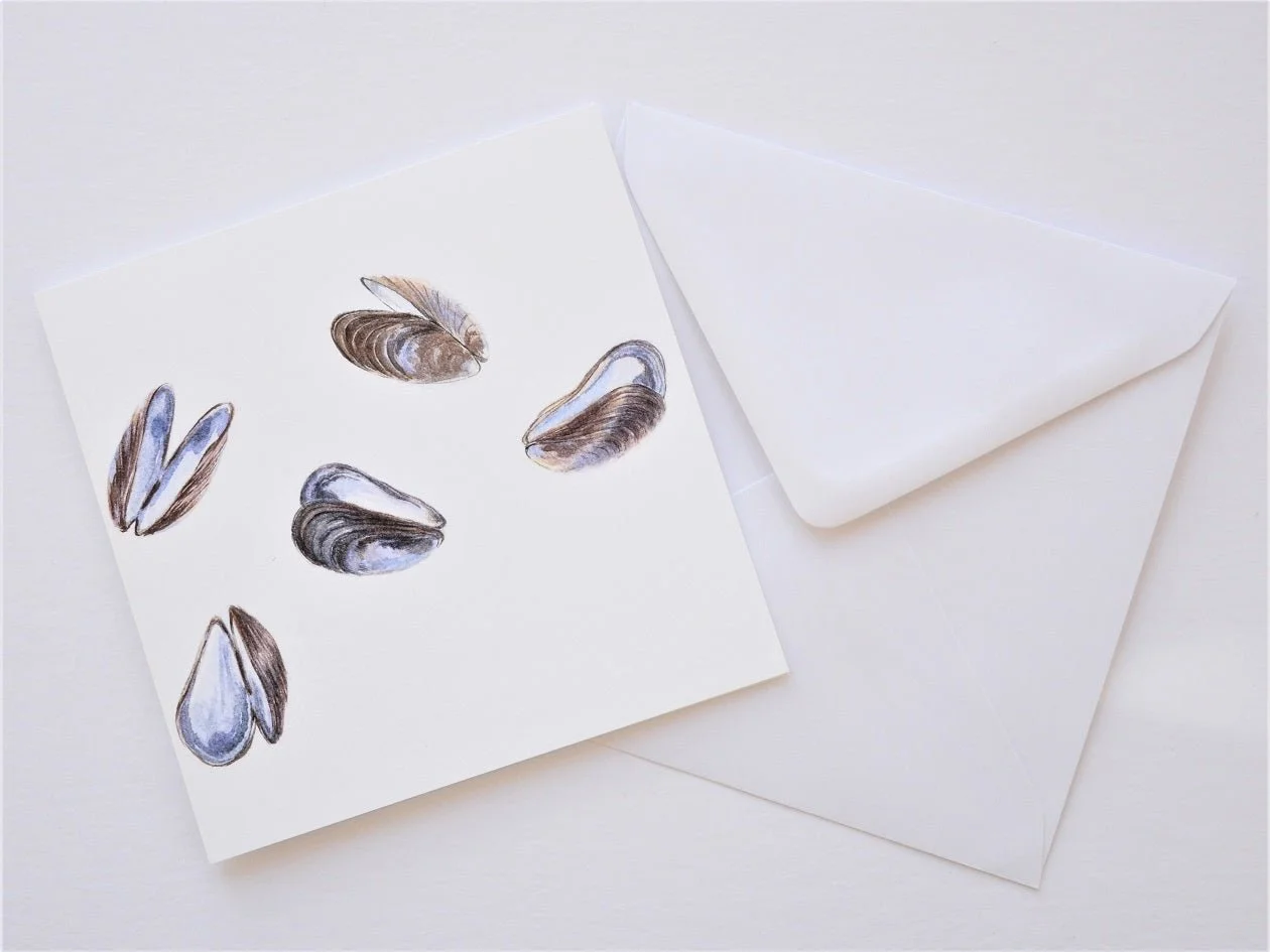 Mauve Mussels of the Sea greetings card shown at an angle with its white envelope