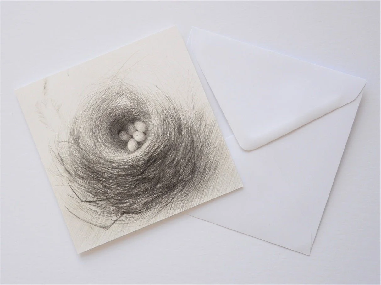 Nested Eggs greetings card shown at an angle with its white envelope