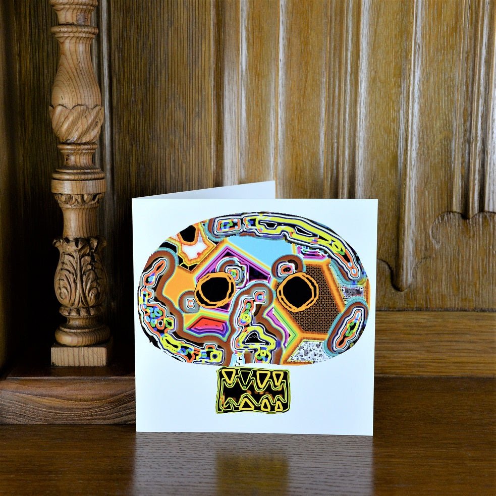 Untitled Mask greetings card standing on a wooden mantelpiece