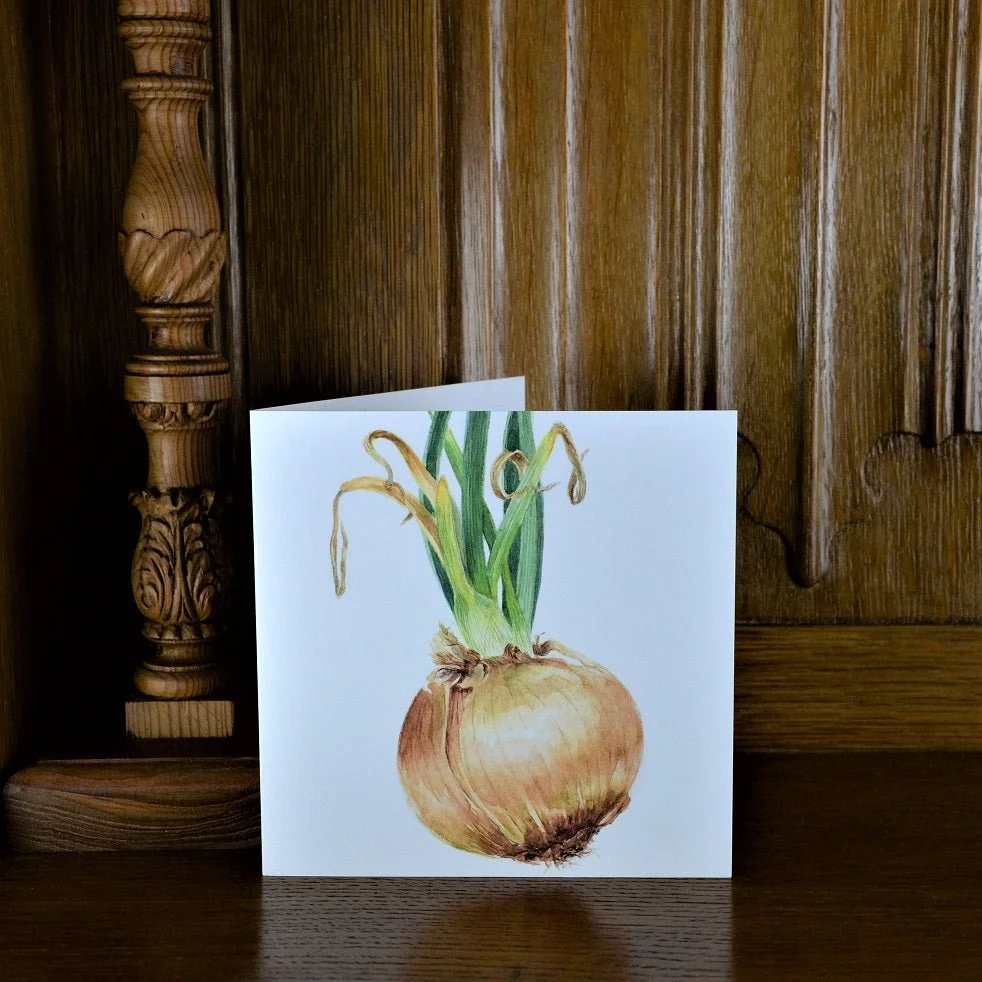 Sprouting Onion Green greetings card standing on a wooden mantelpiece