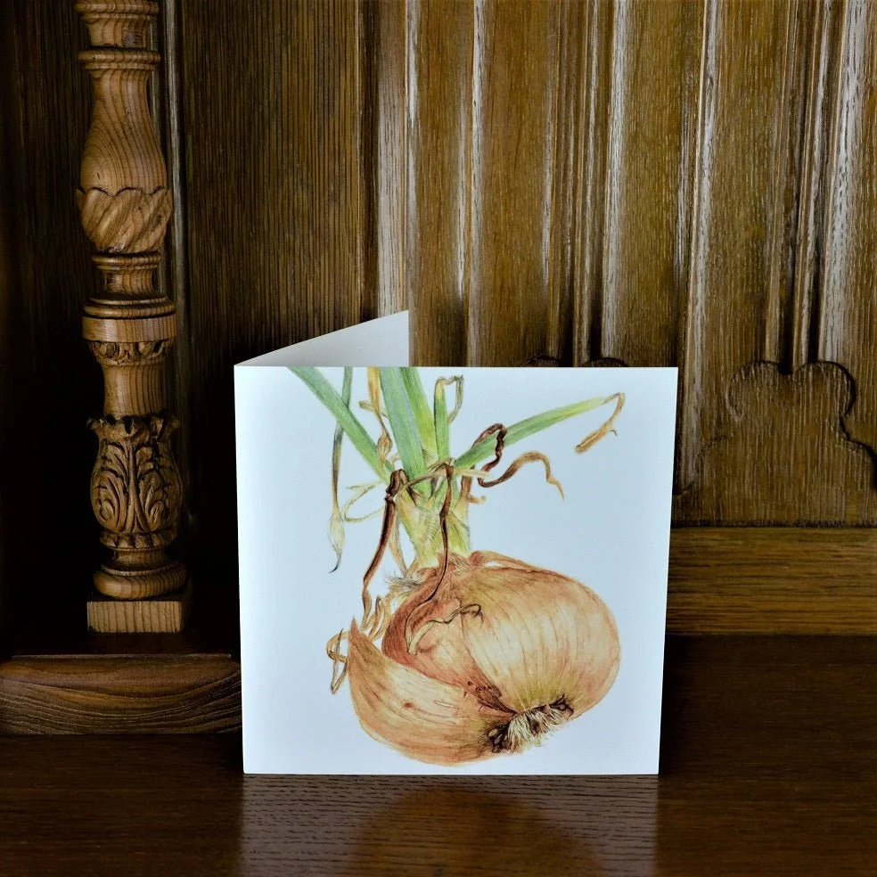 Sprouting Onion Roots greetings card standing on a wooden mantelpiece