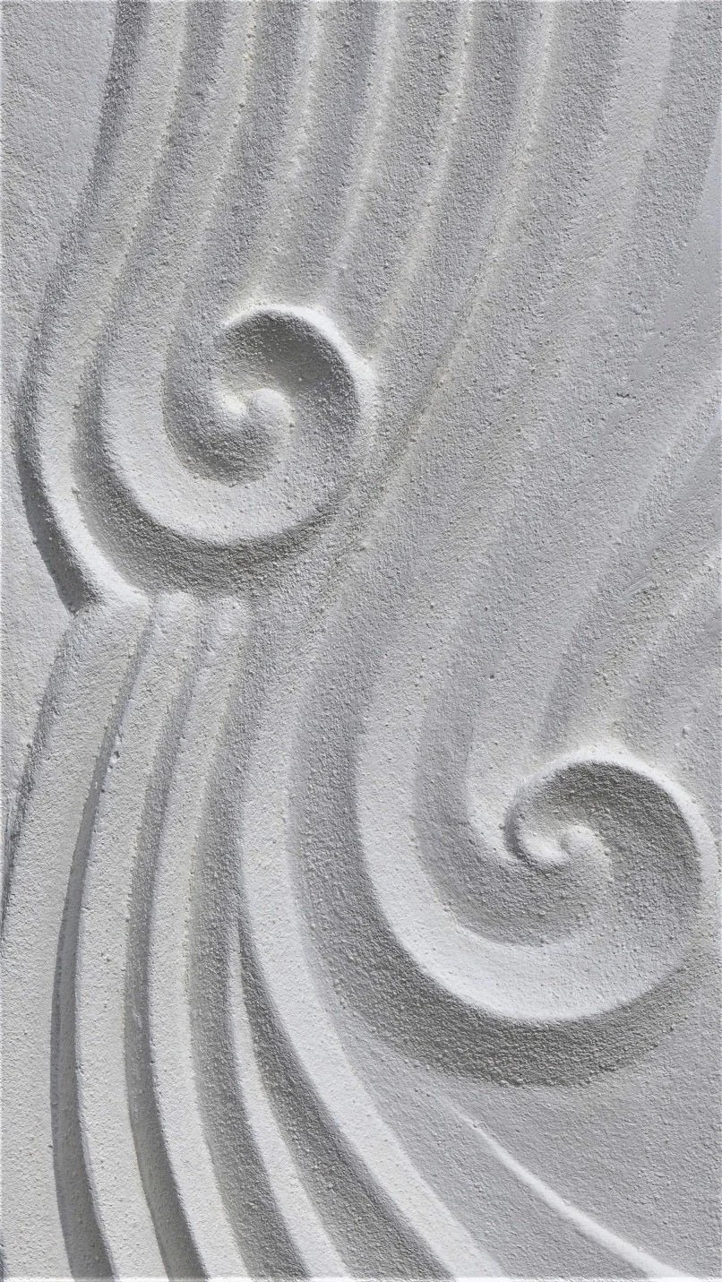 Close view of the Deco Dune Ripple wall sculpture showing carved spirals set into rippled sand lines