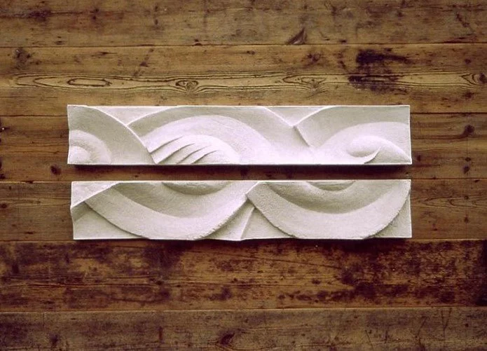 Three Frozen Decowaves wall sculpture hung horizontally as two long carved wave panels on rustic timber