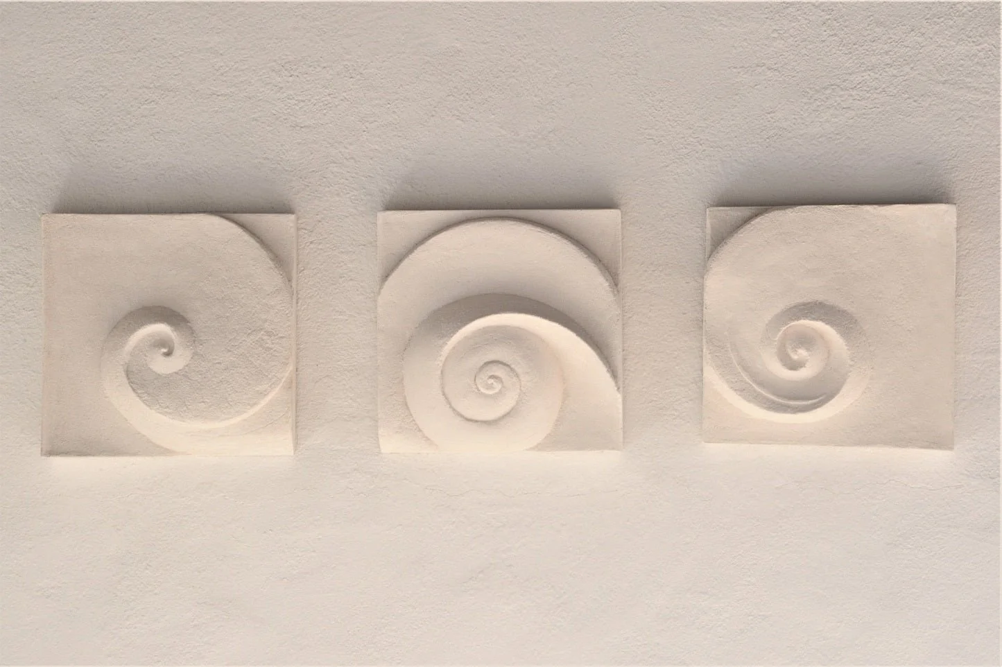 Moonphases Three wall sculpture in a plain white finish, the three spirals reading as phases of the moon